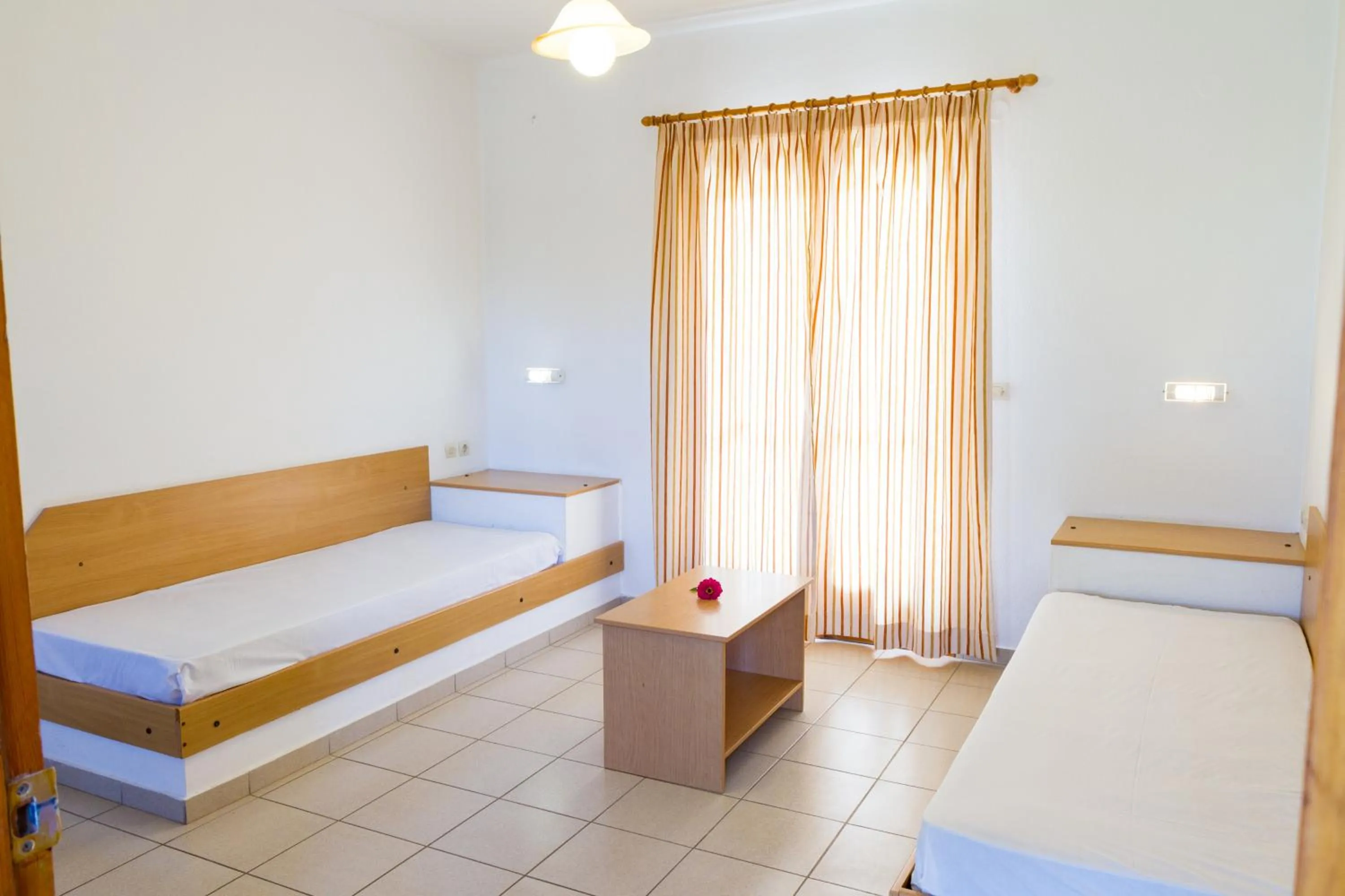 Living room, Bed in Ideal Hotel