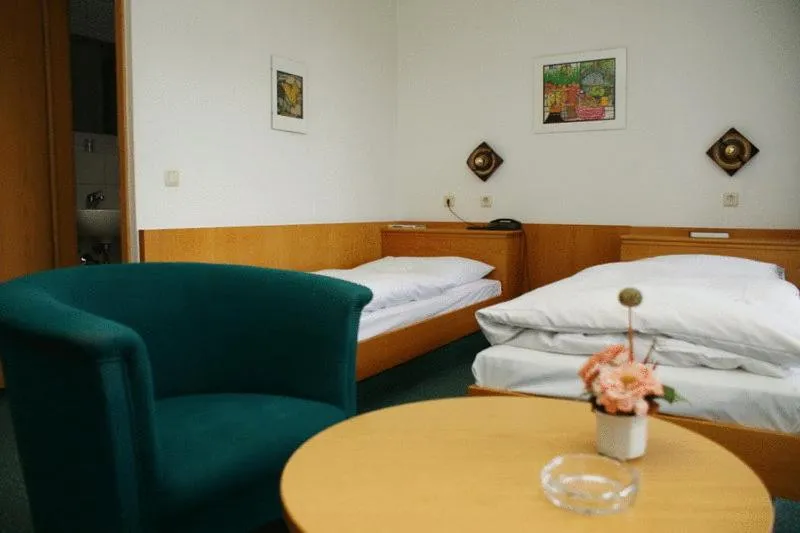 Seating area, Bed in Hotel Koch Maingau