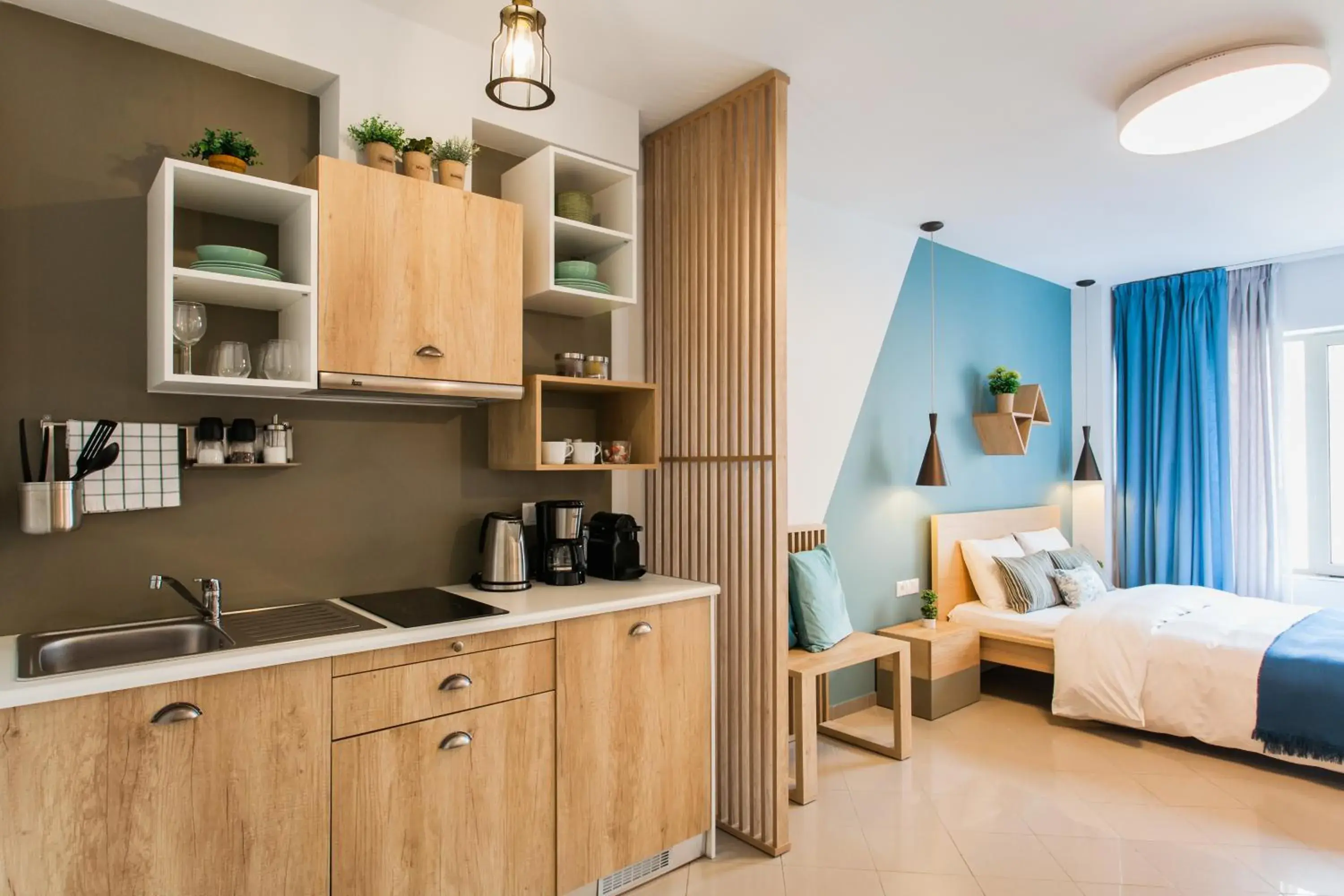 Kitchen or kitchenette, Bed in Dynasta Central Suites Kitchen or kitchenette, Bed in Dynasta Central Suites