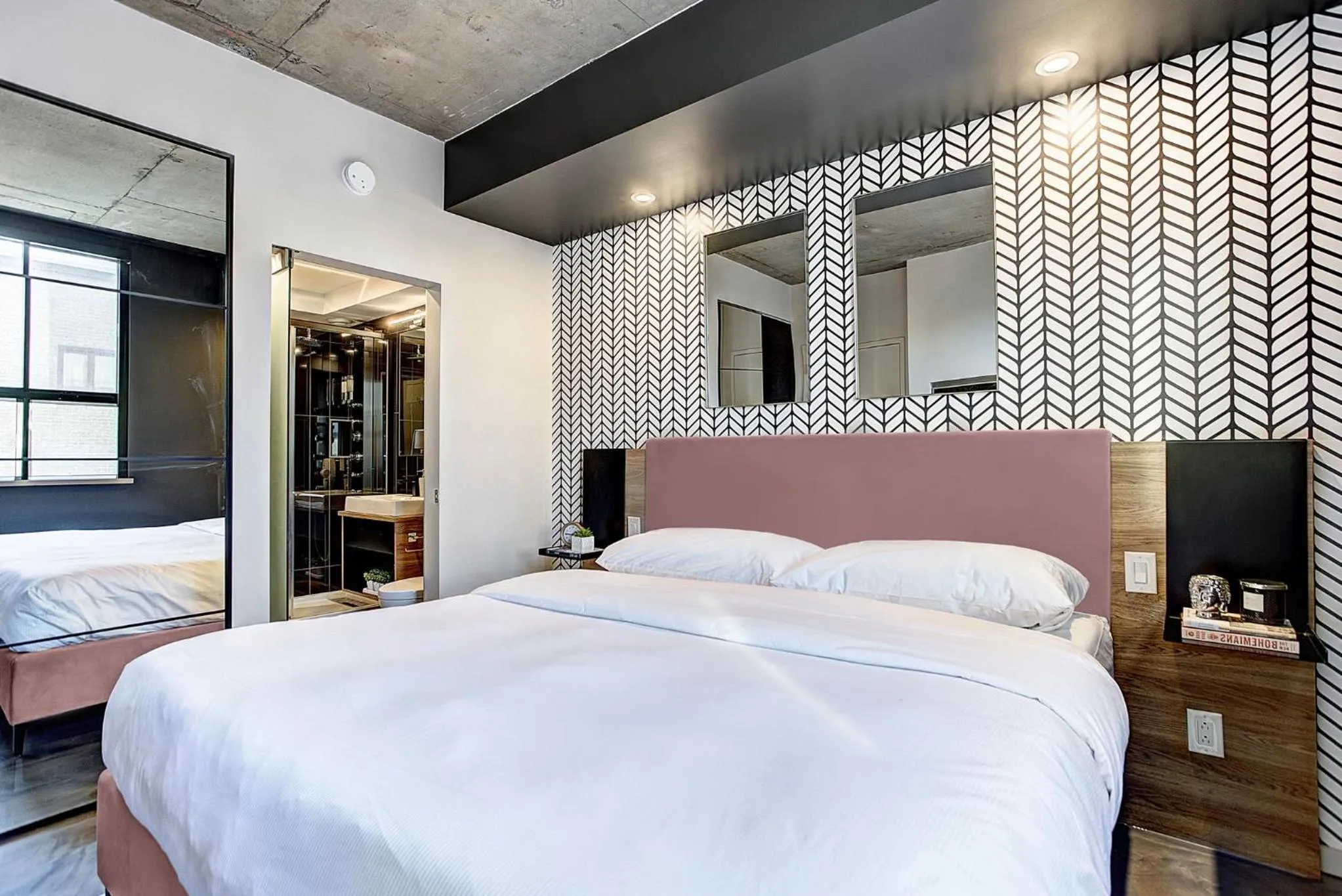 Bed in Pierce Boutique Apartments by Simplissimmo