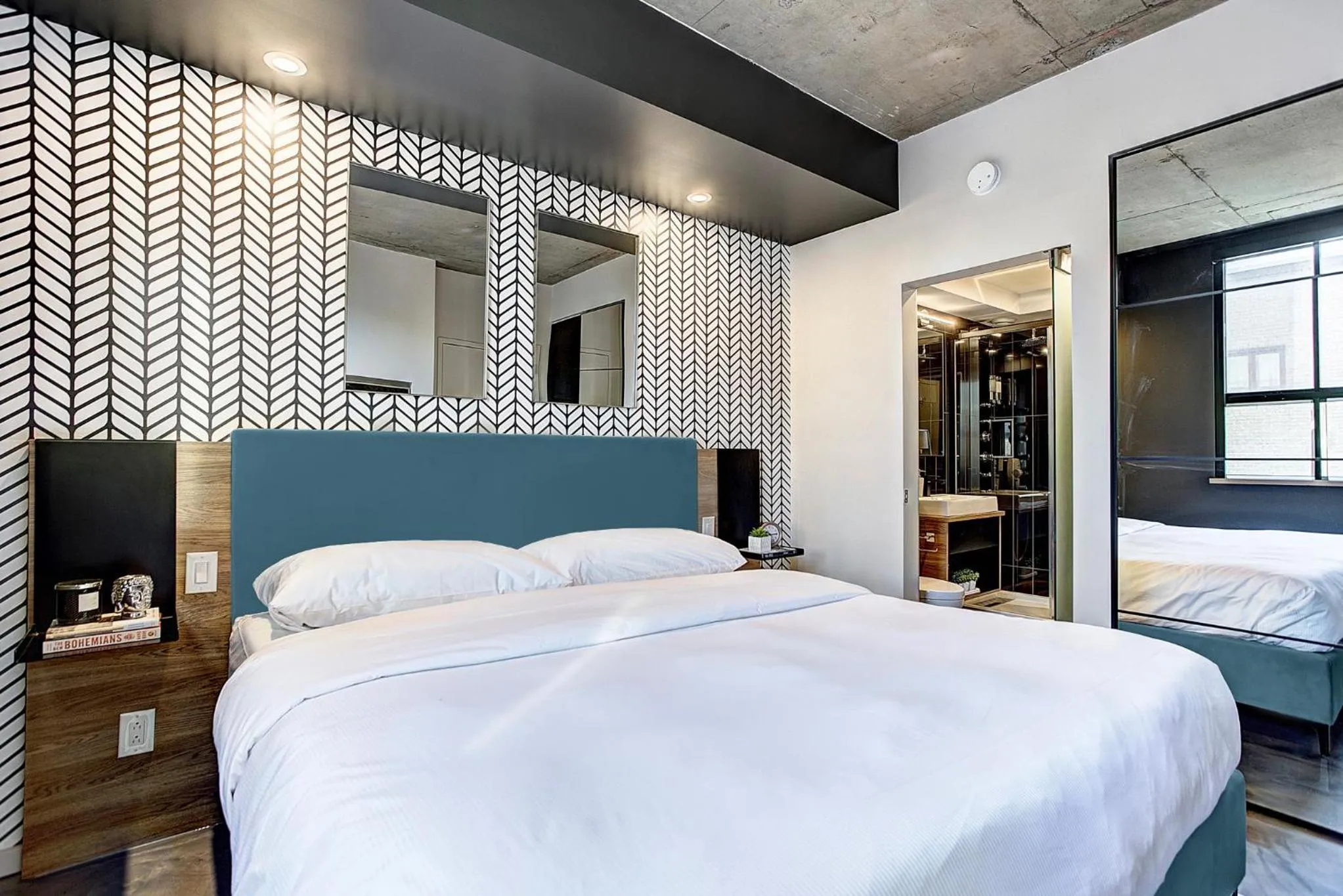 Bed in Pierce Boutique Apartments by Simplissimmo