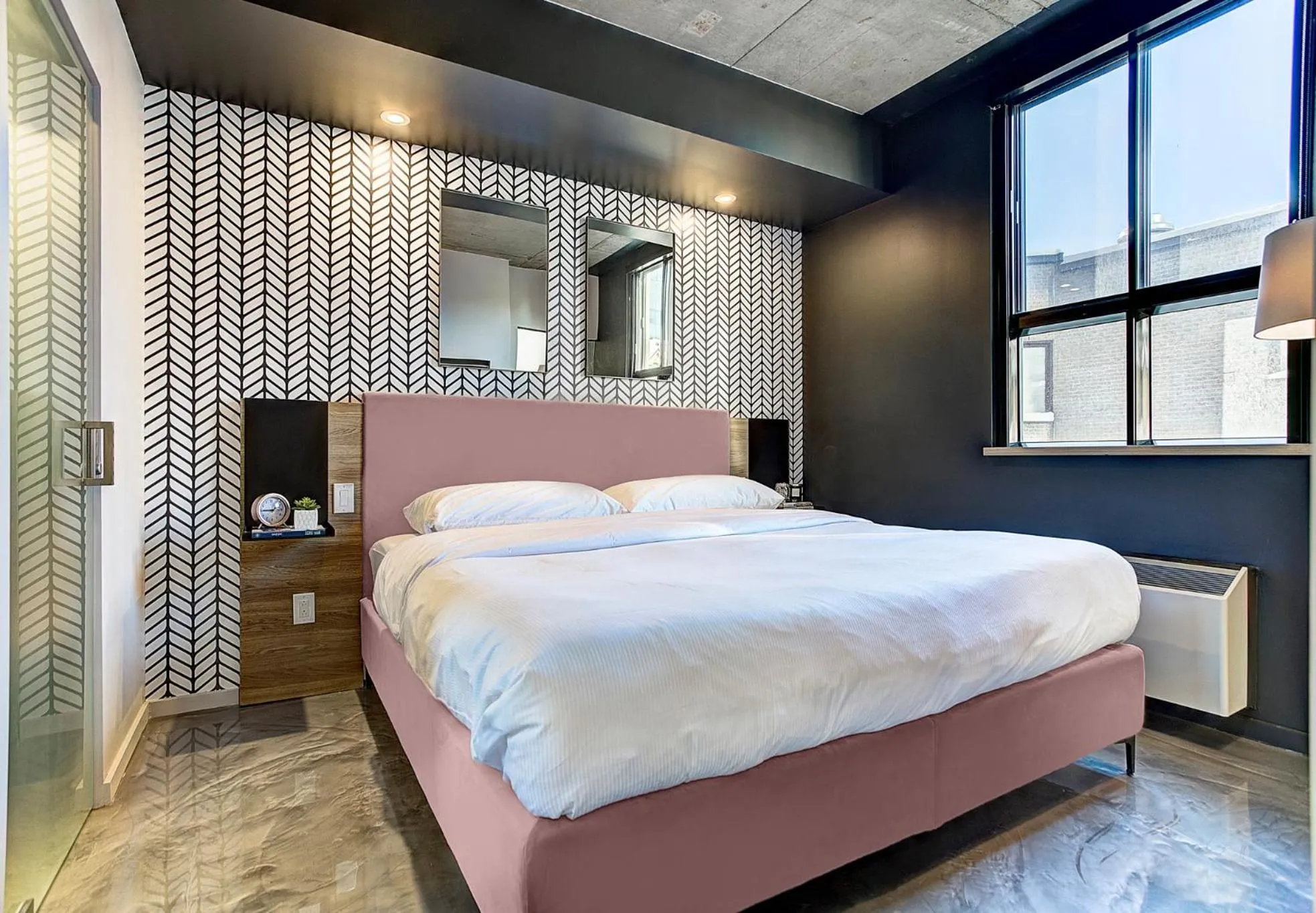 Bed in Pierce Boutique Apartments by Simplissimmo