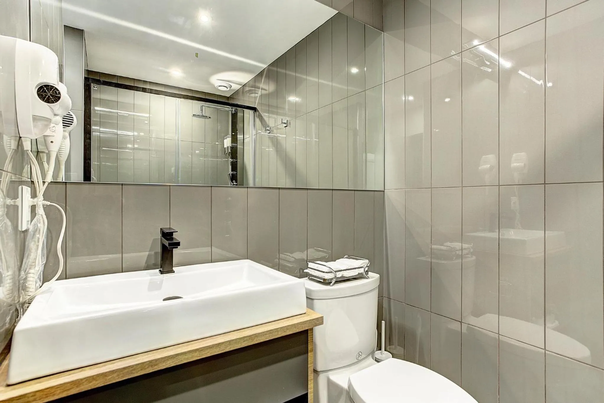 Bathroom in Pierce Boutique Apartments by Simplissimmo