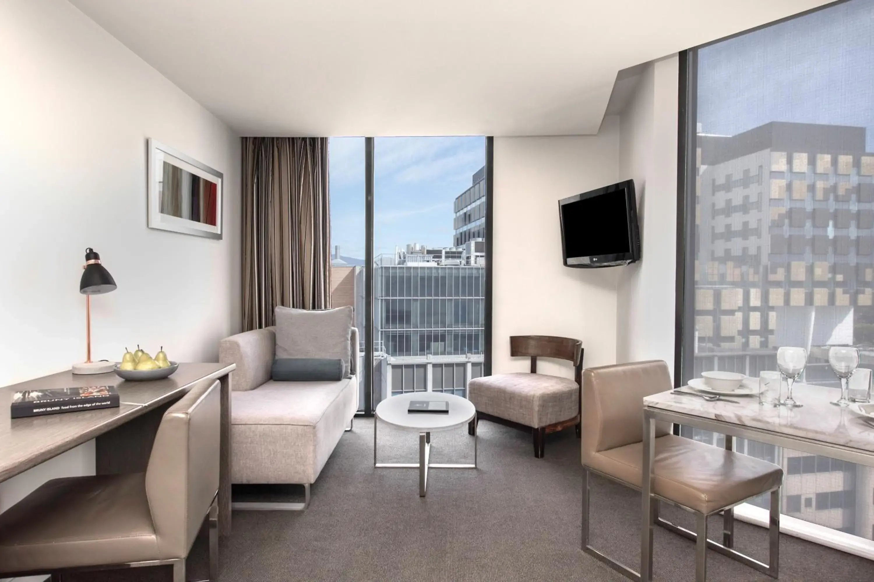 Living room in Mantra Collins Hotel Living room in Mantra Collins Hotel