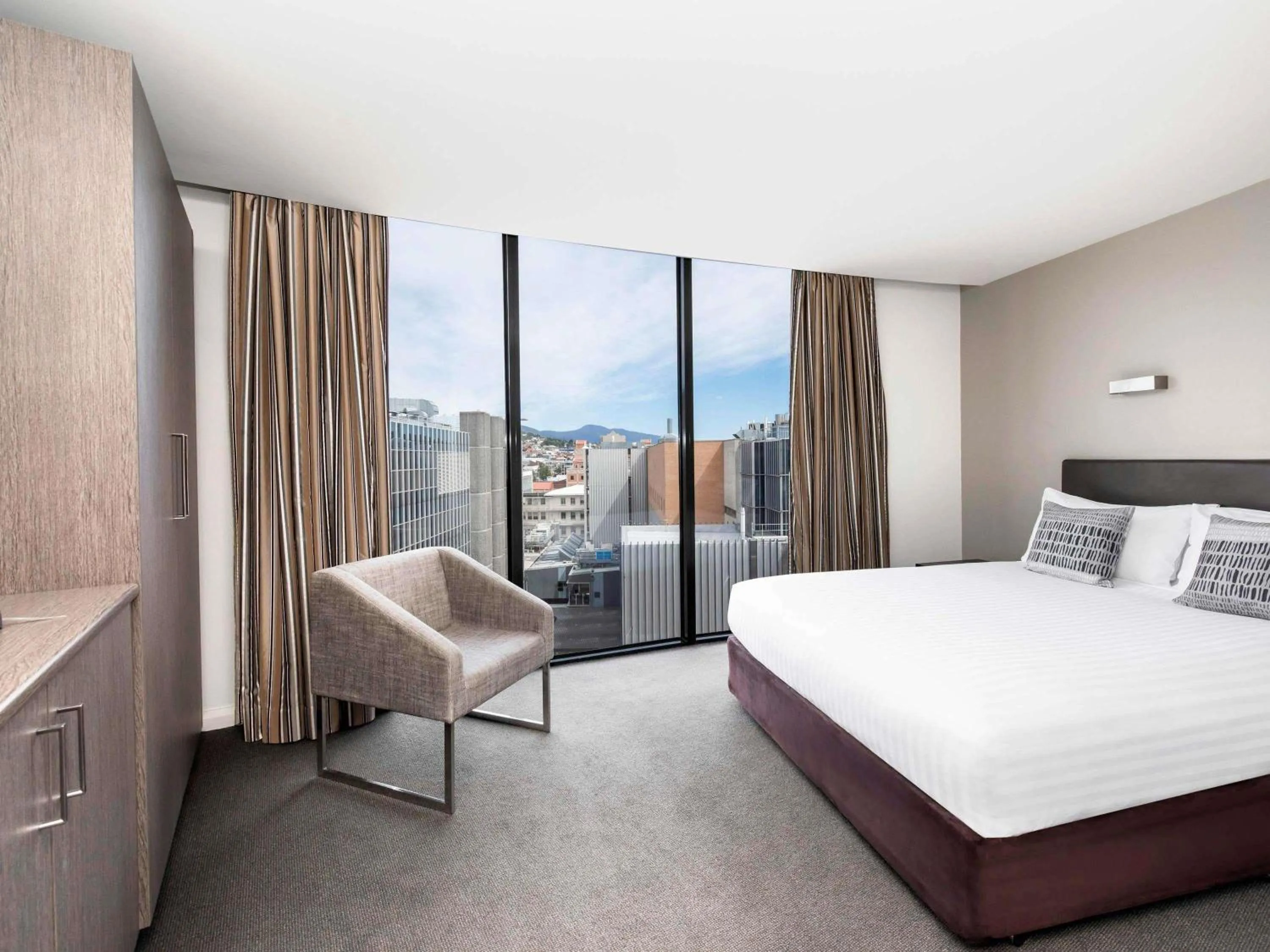 Property building, Bed in Mantra Collins Hotel