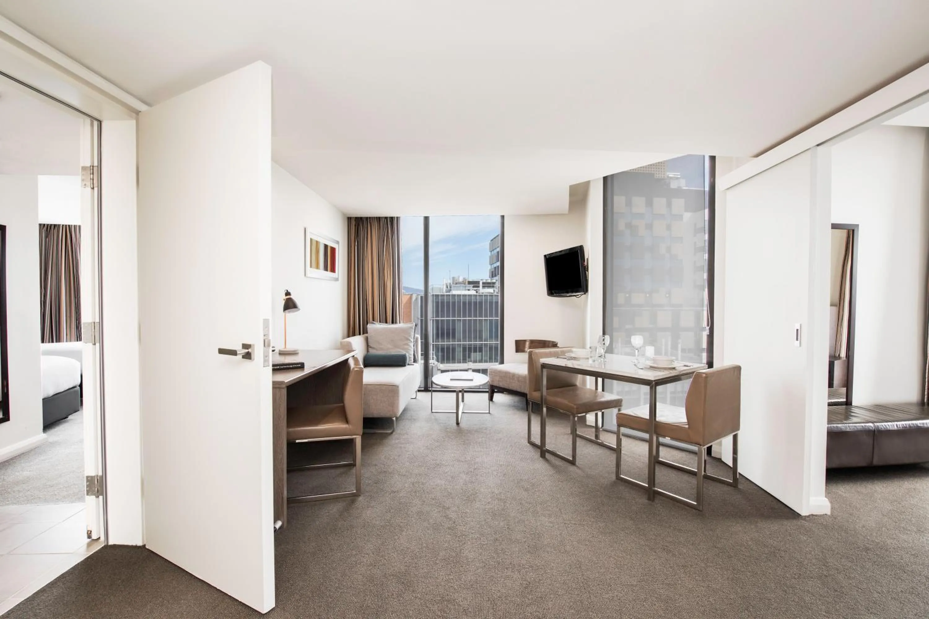 Living room in Mantra Collins Hotel