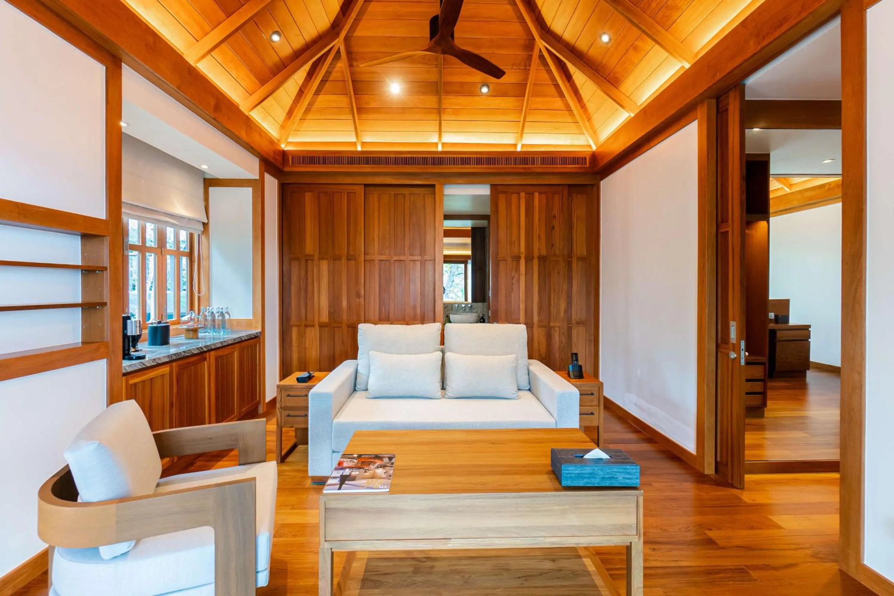 Living room, Bed in The Surin Phuket