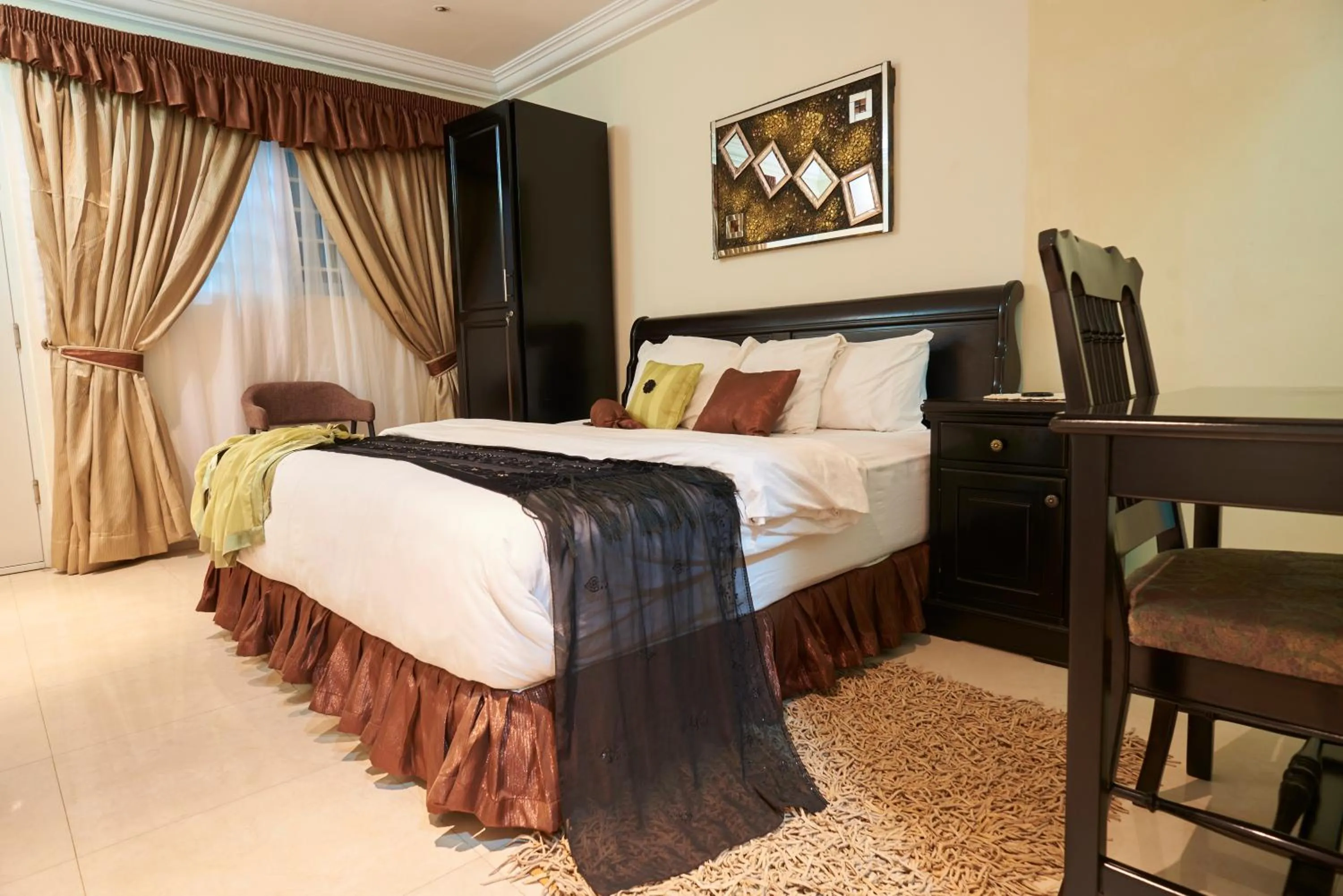 Bed in The Ritzz Exclusive Guest House