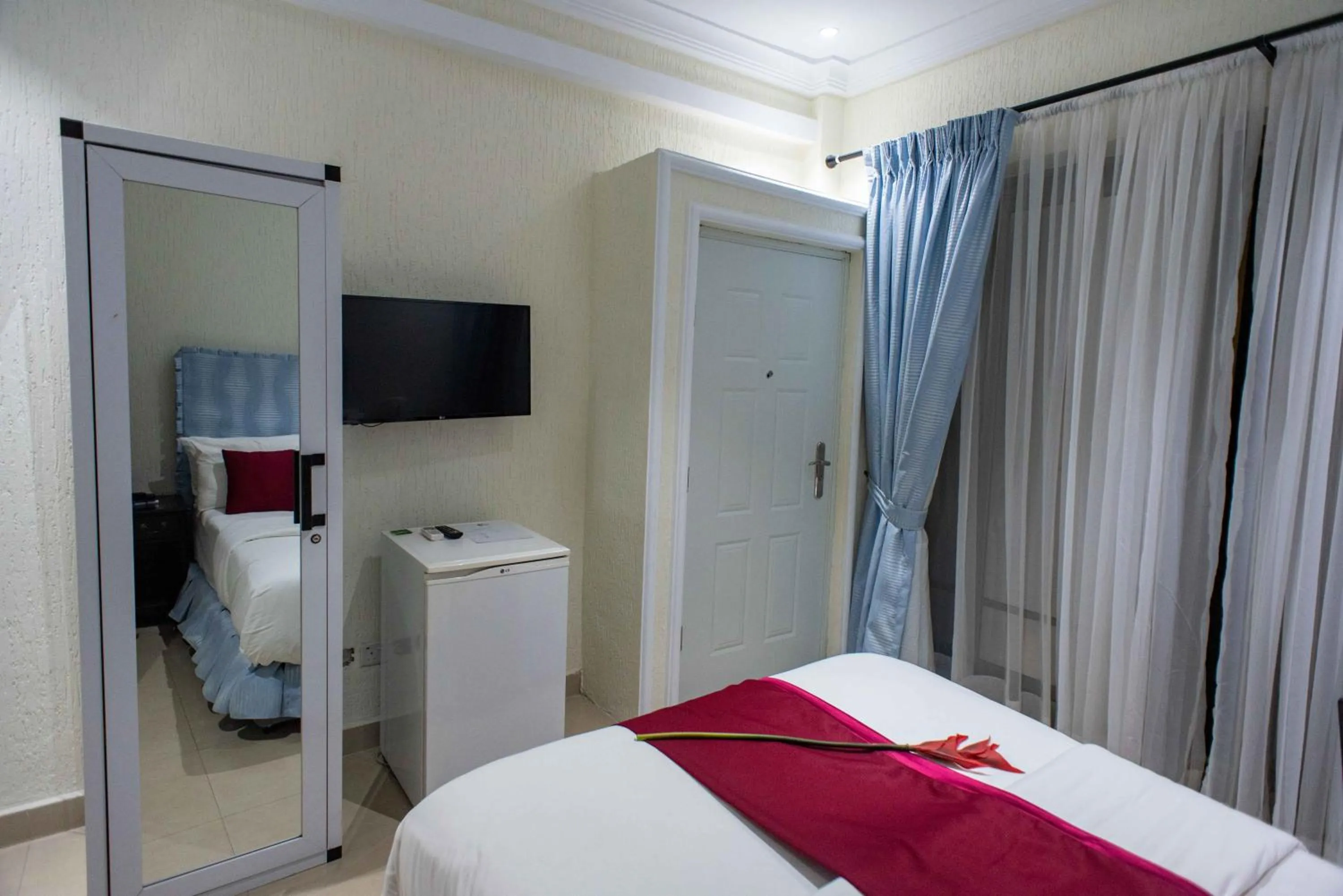 Bed in The Ritzz Exclusive Guest House