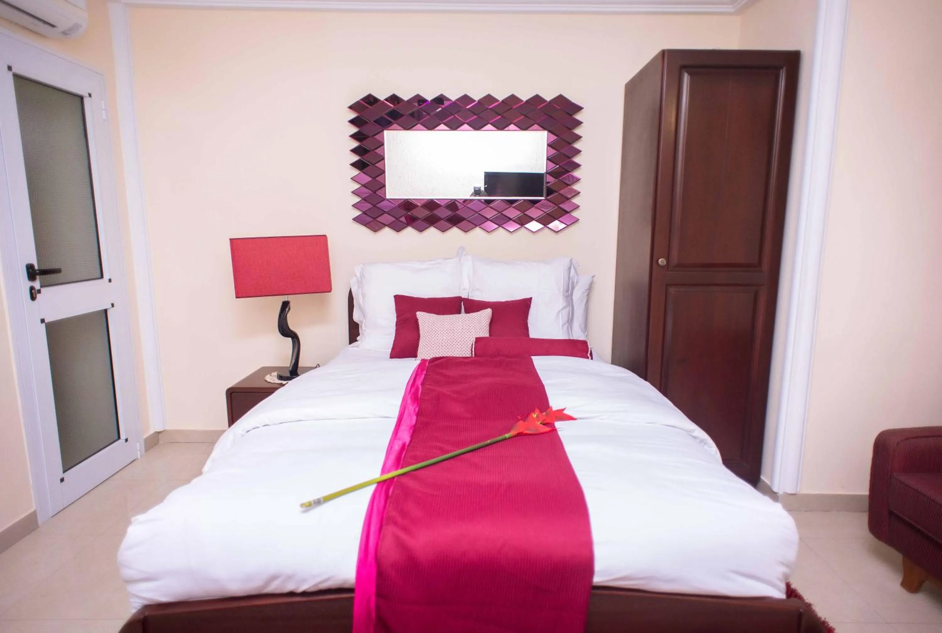 Bed in The Ritzz Exclusive Guest House