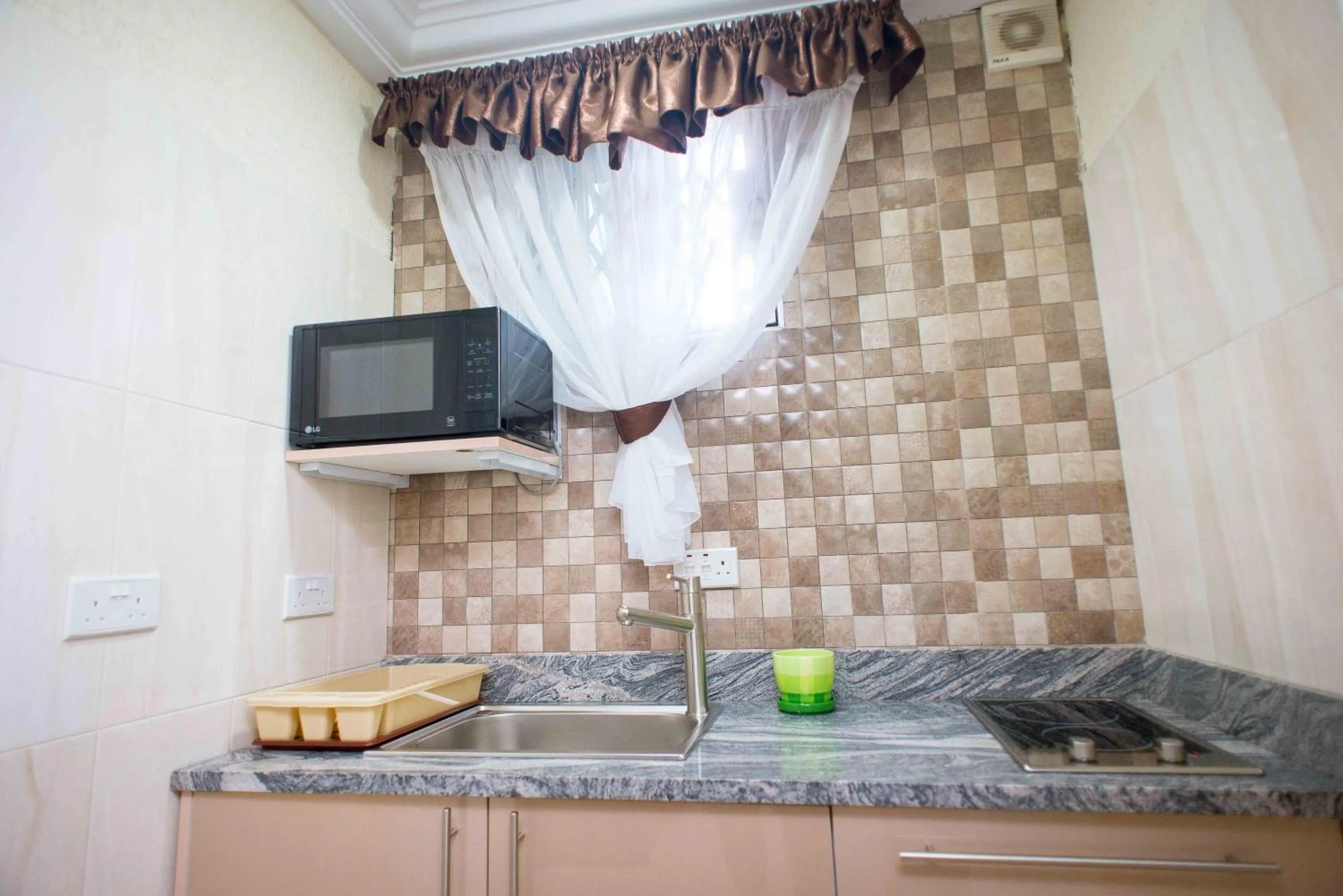 Kitchen or kitchenette in The Ritzz Exclusive Guest House