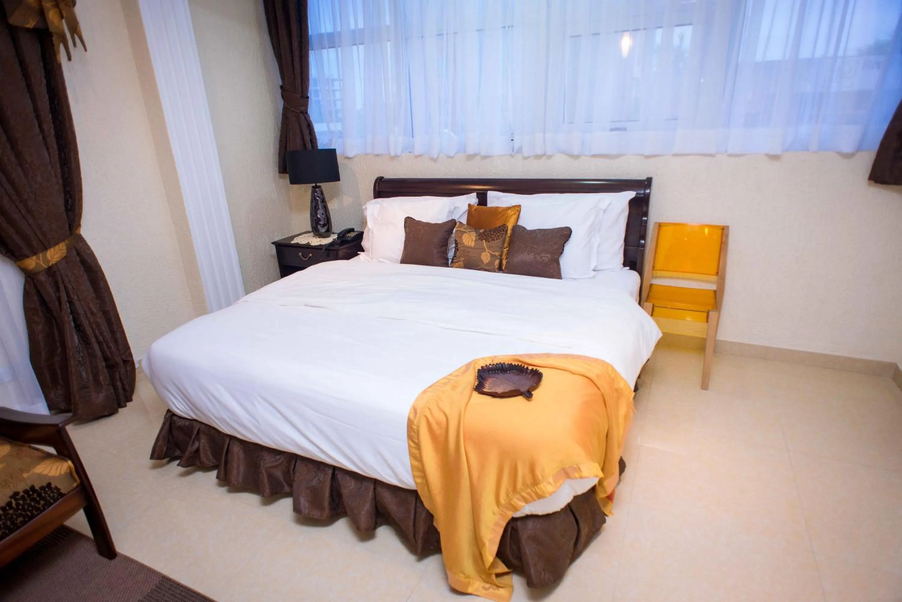 Bed in The Ritzz Exclusive Guest House