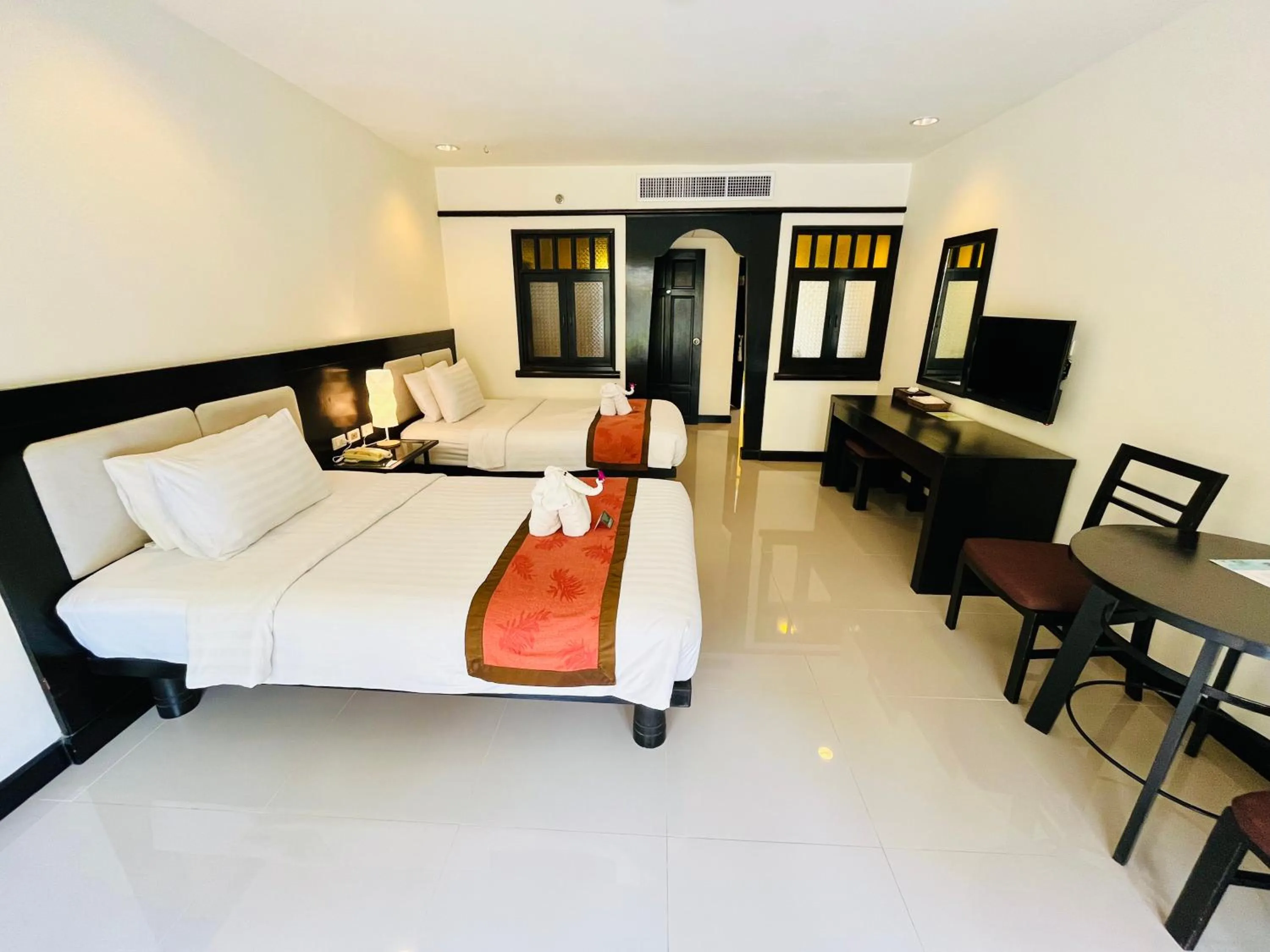Bed in Woraburi Phuket Resort & Spa - SHA Plus