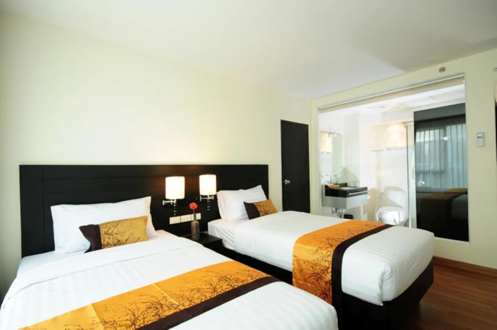 Bed in Boss Suites Nana Hotel