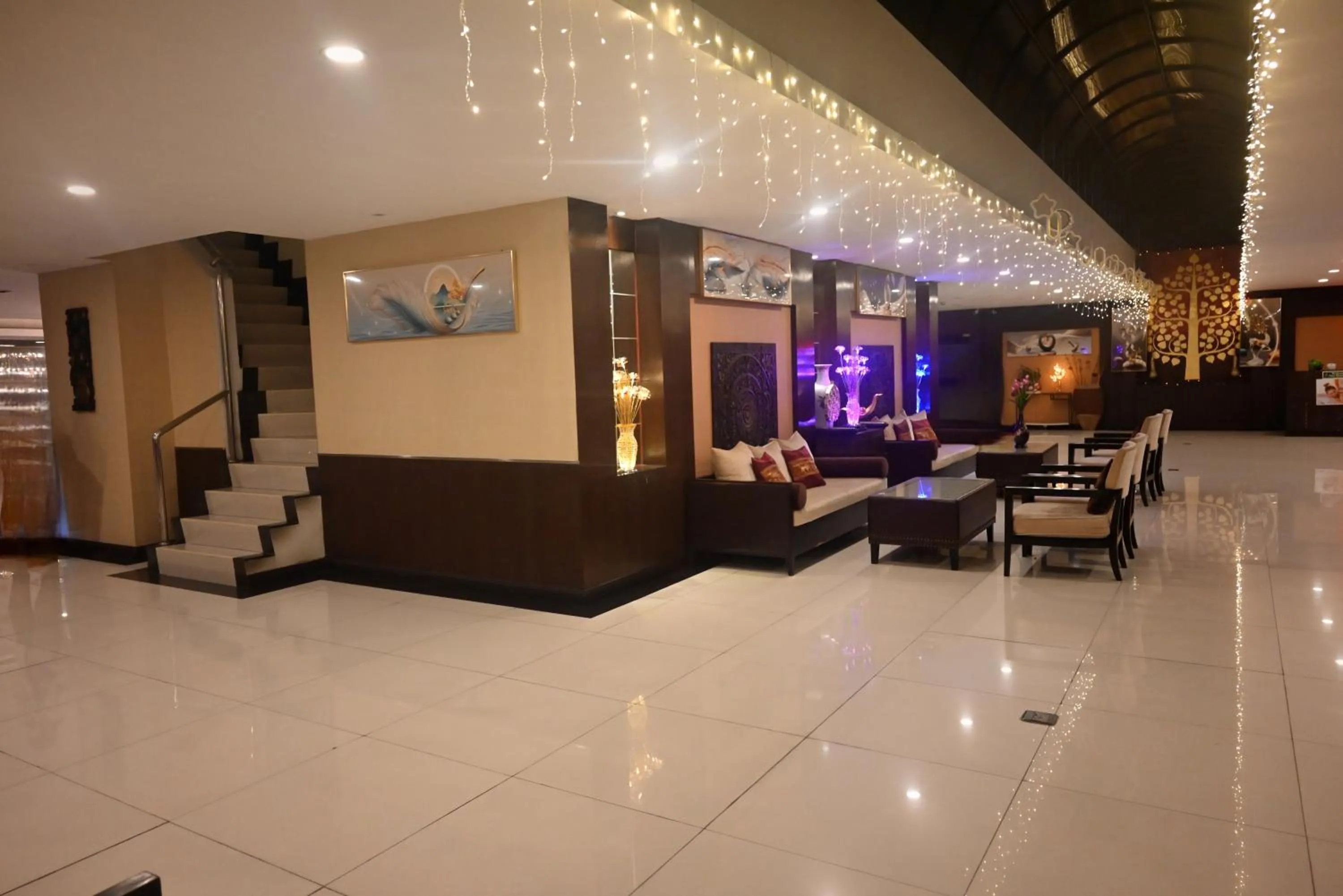 Seating area in Boss Suites Nana Hotel