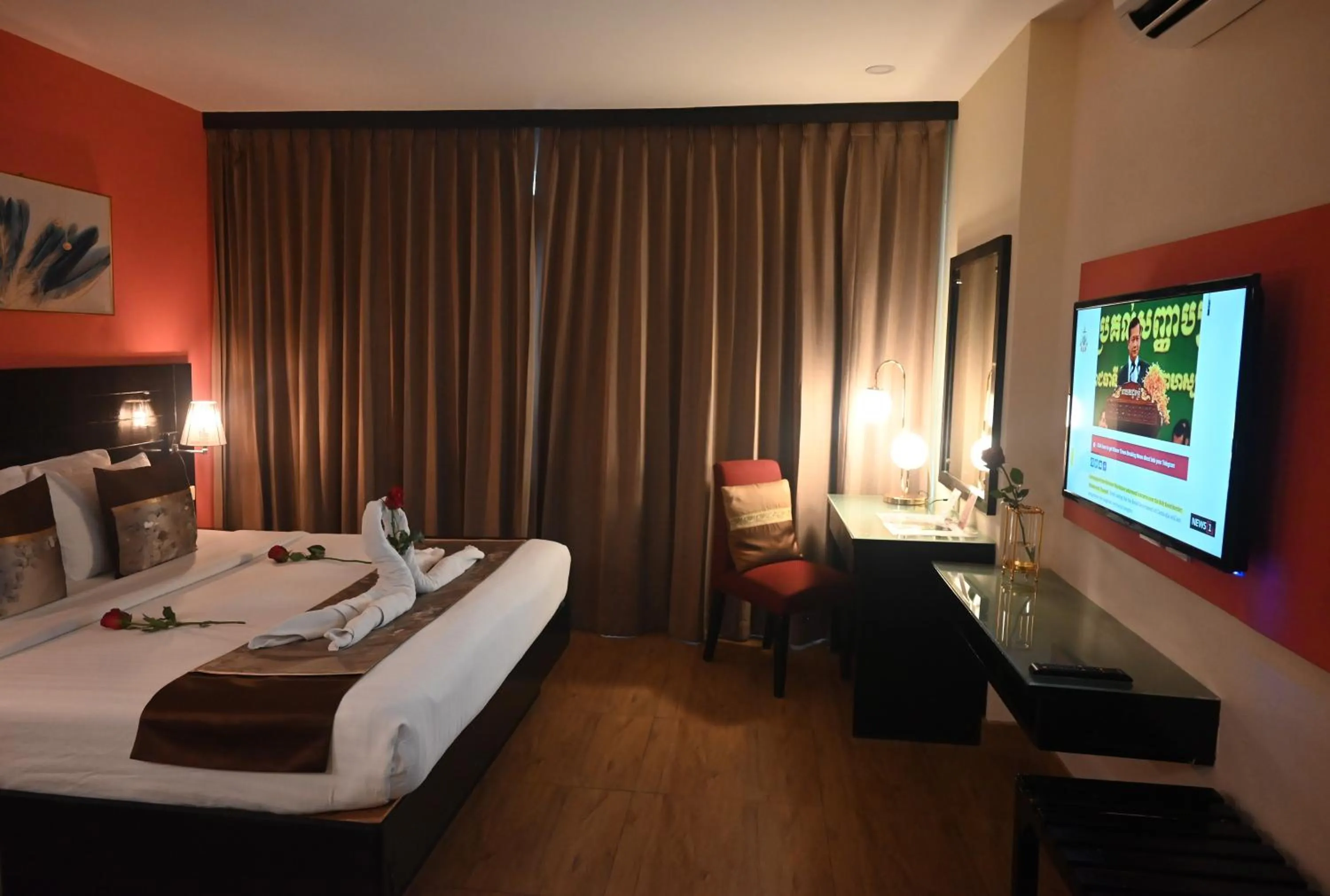 Bed in Boss Suites Nana Hotel