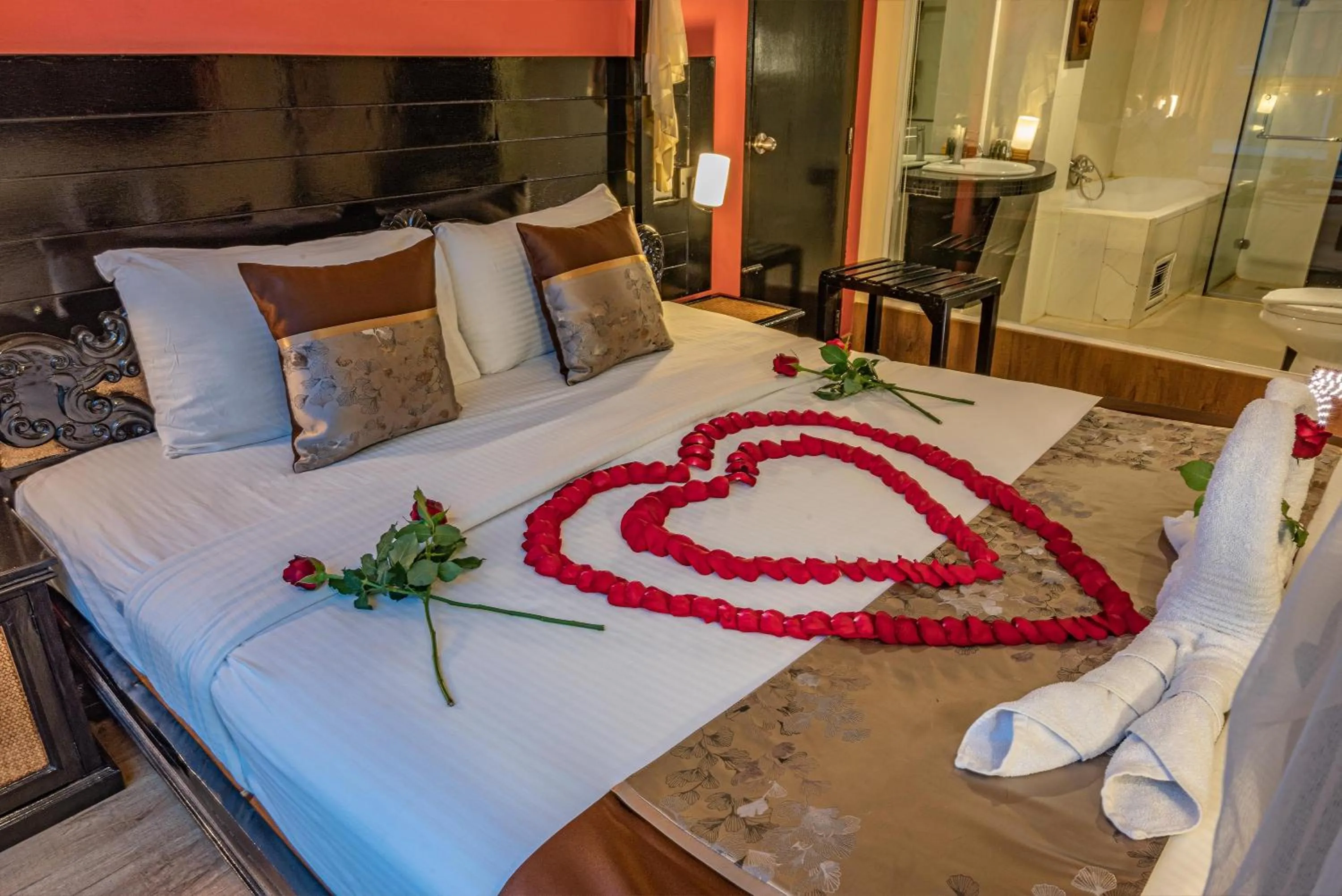 Bed in Boss Suites Nana Hotel