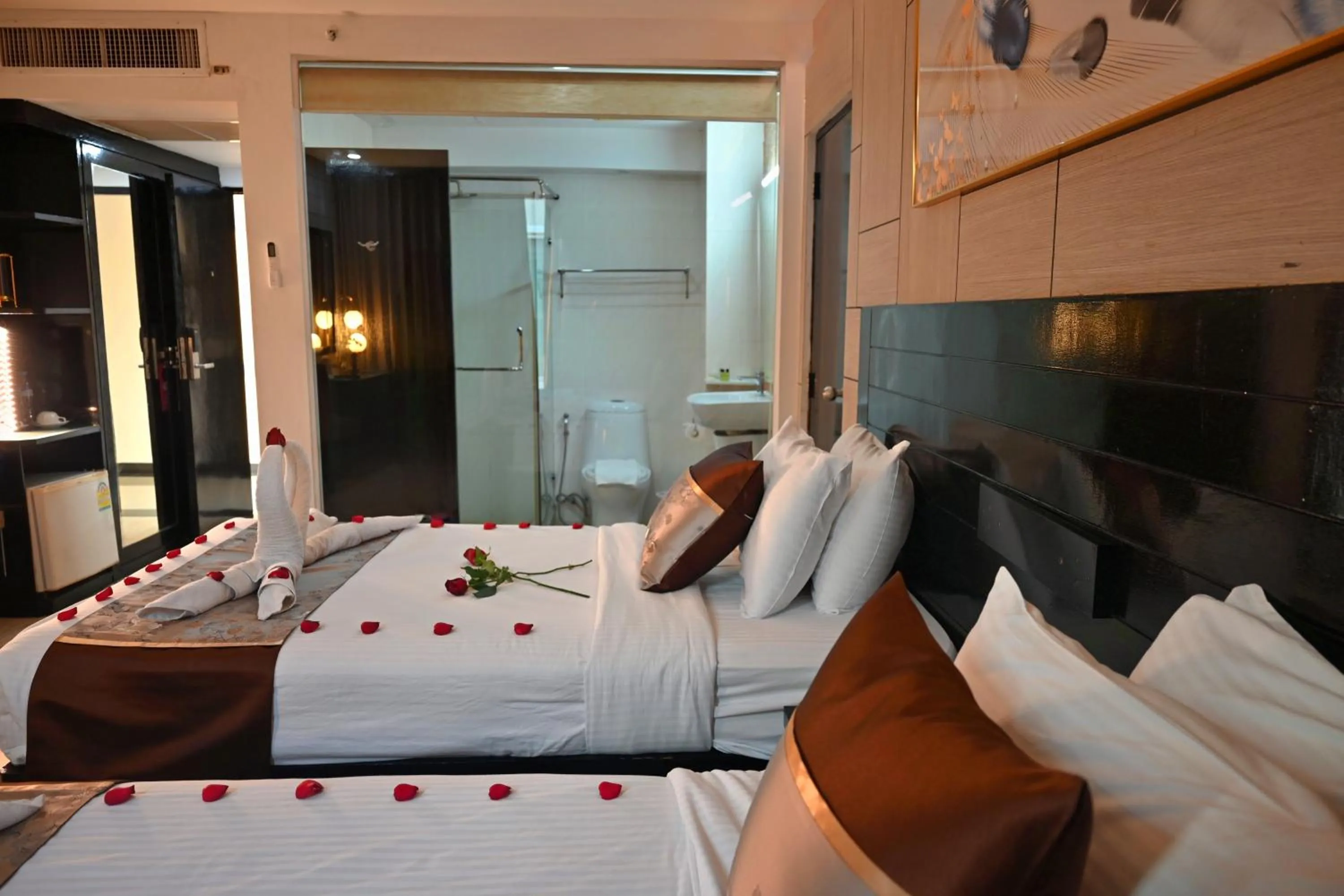 Bed in Boss Suites Nana Hotel