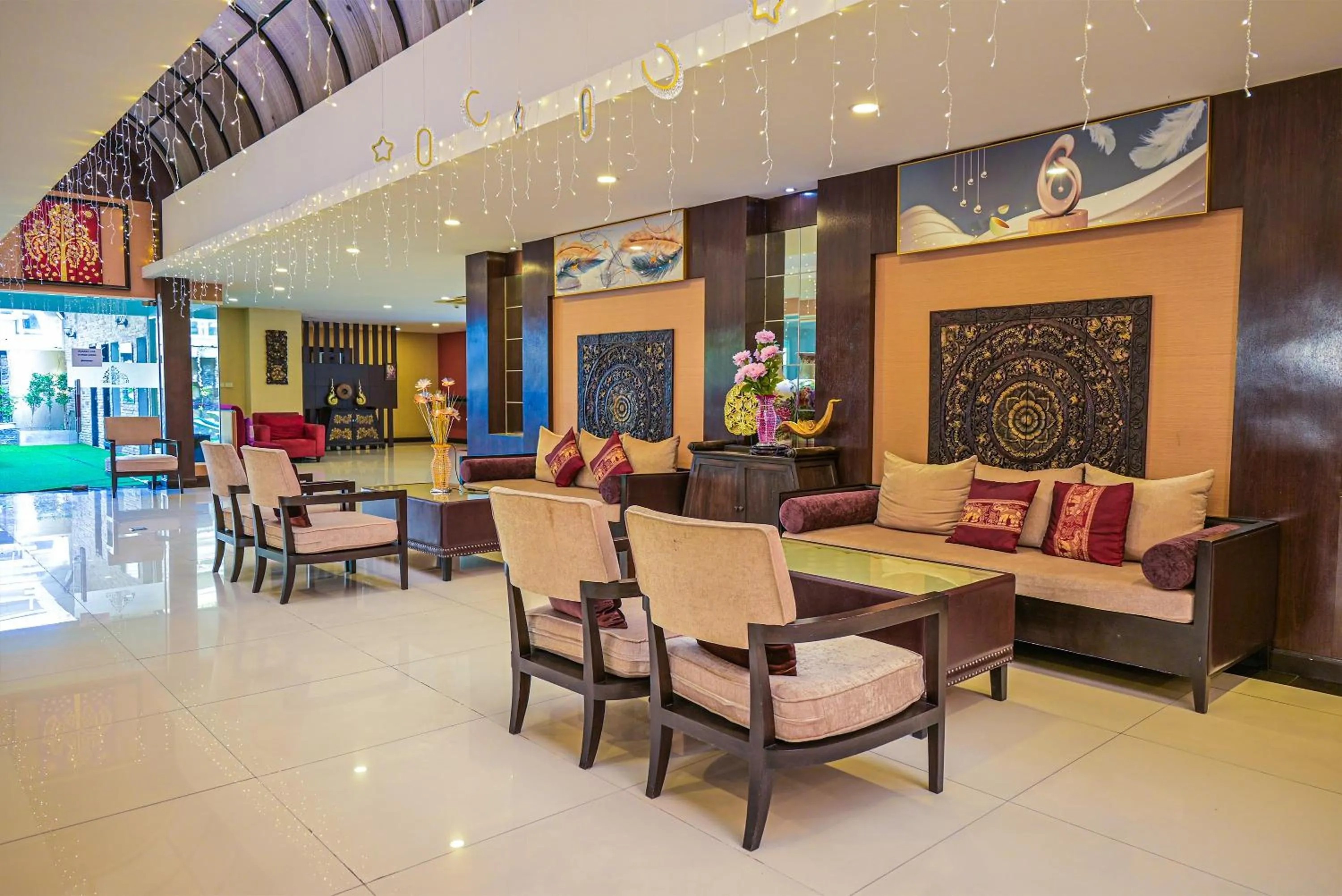 Seating area in Boss Suites Nana Hotel