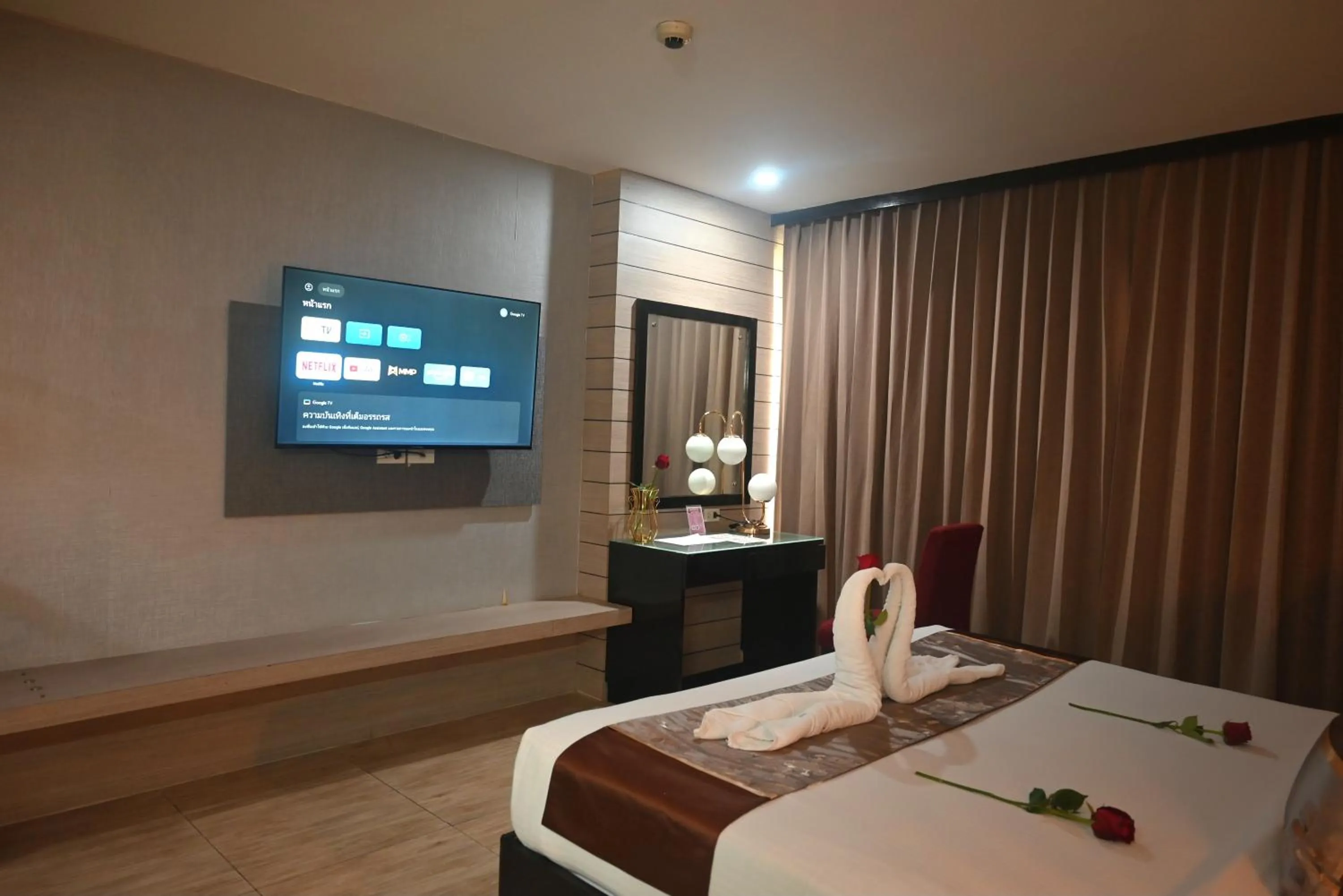 Bed in Boss Suites Nana Hotel