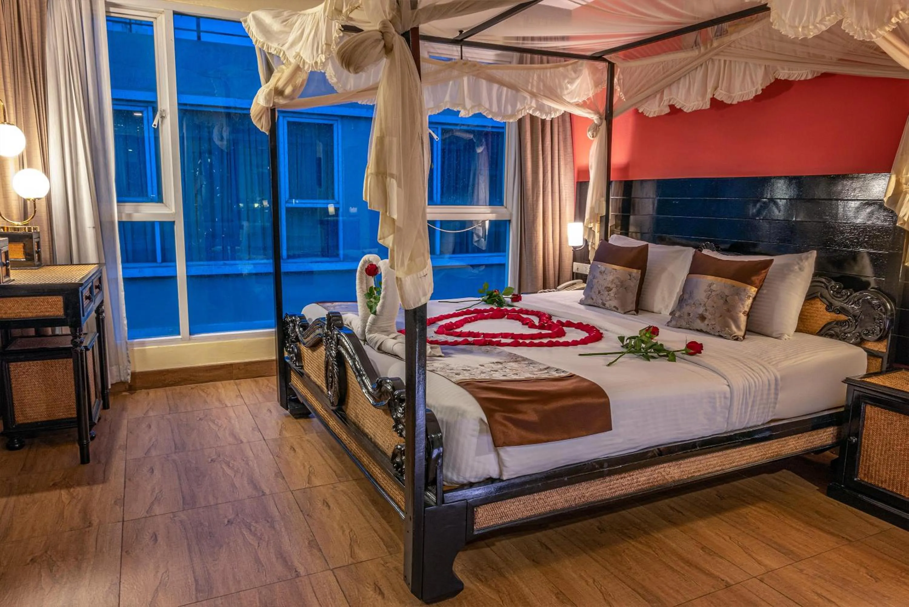 Bed in Boss Suites Nana Hotel