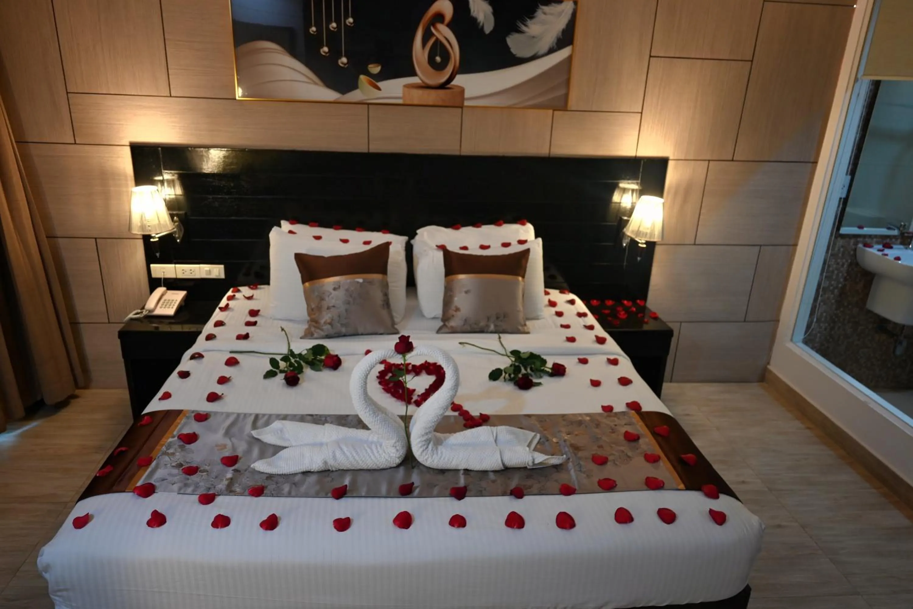 Bed in Boss Suites Nana Hotel