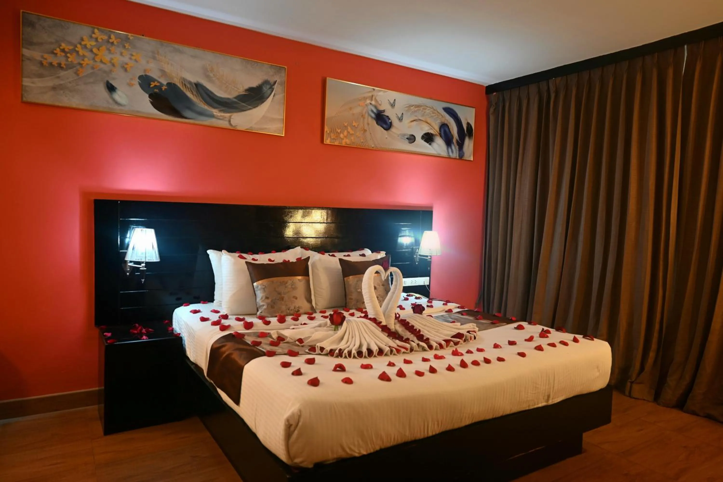 Bed in Boss Suites Nana Hotel