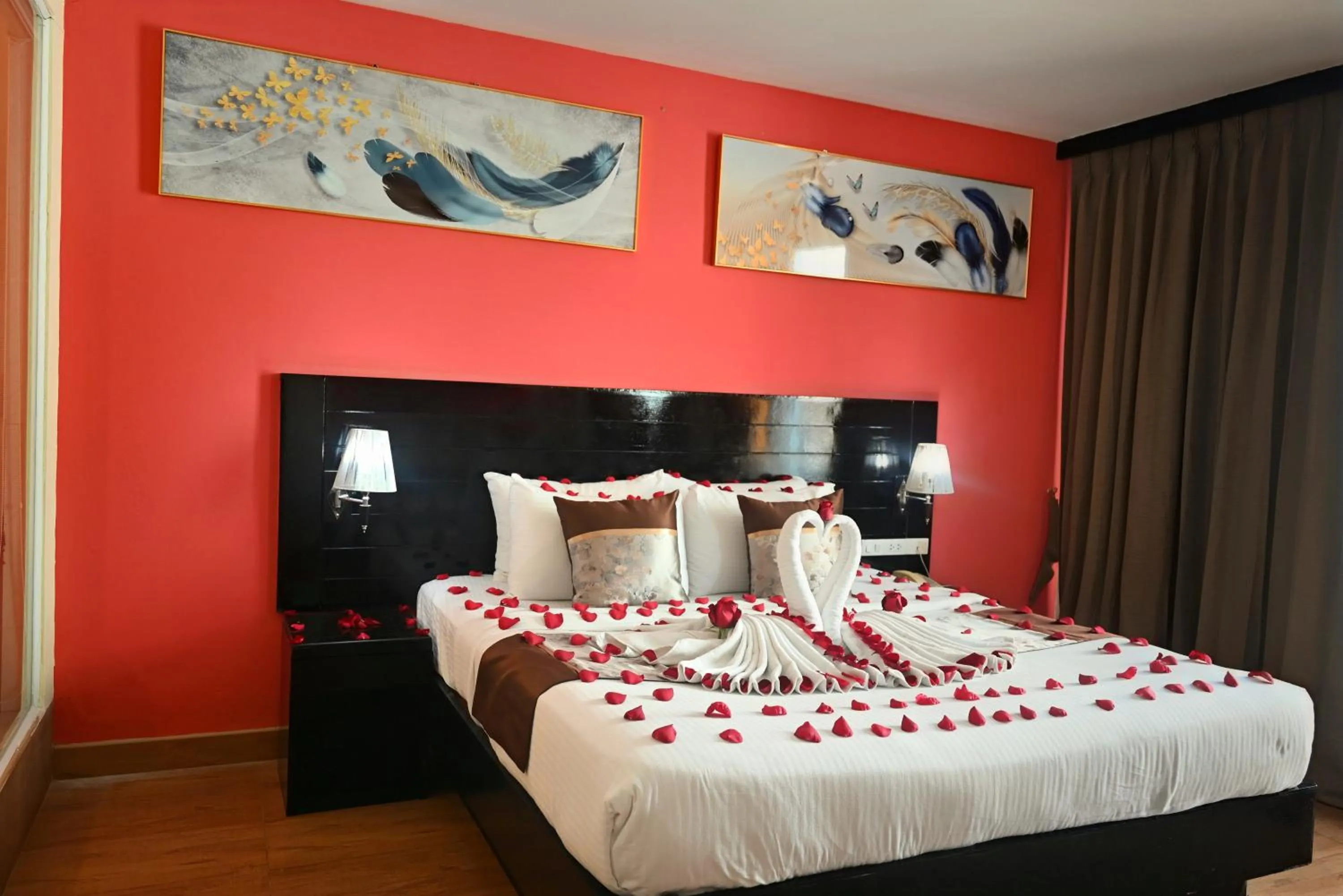 Bed in Boss Suites Nana Hotel