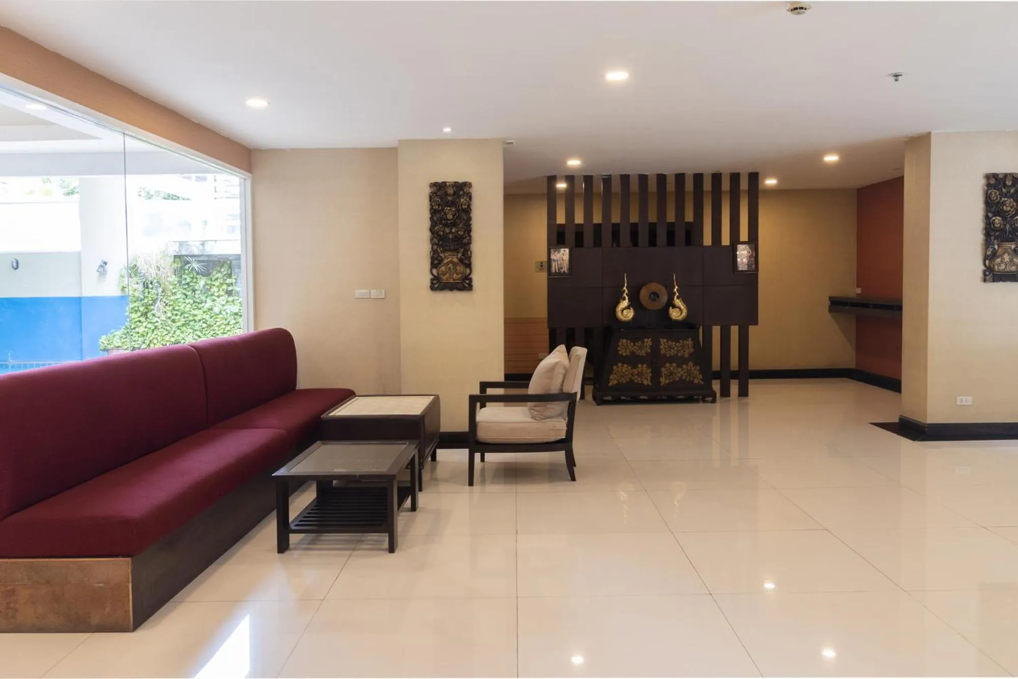 Seating area in Boss Suites Nana Hotel