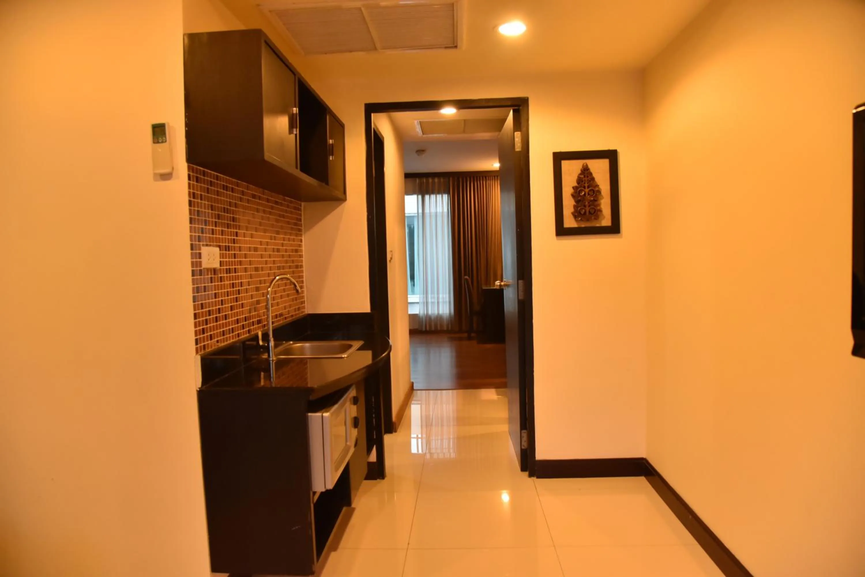 Swimming pool in Boss Suites Nana Hotel