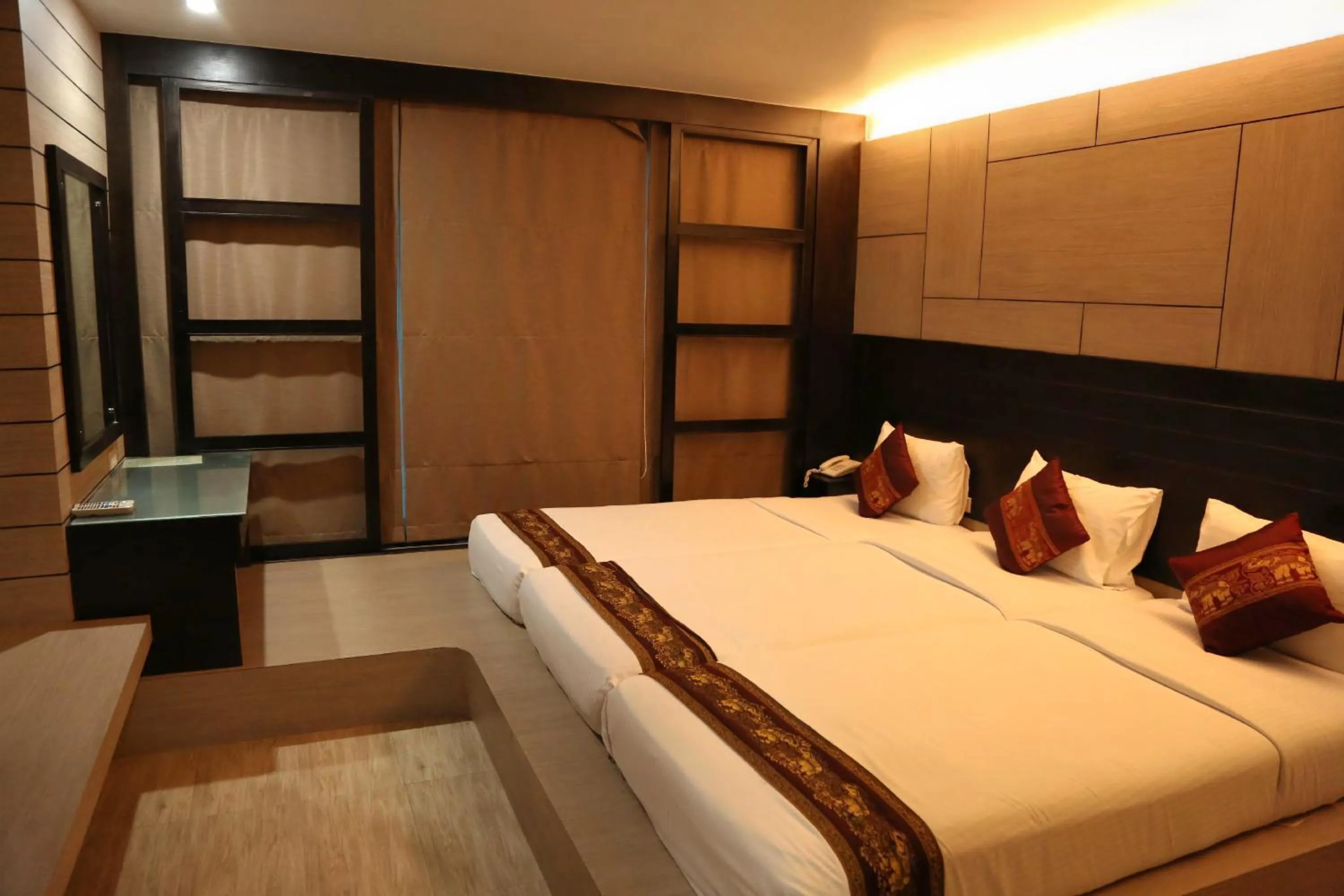 Bed in Boss Suites Nana Hotel