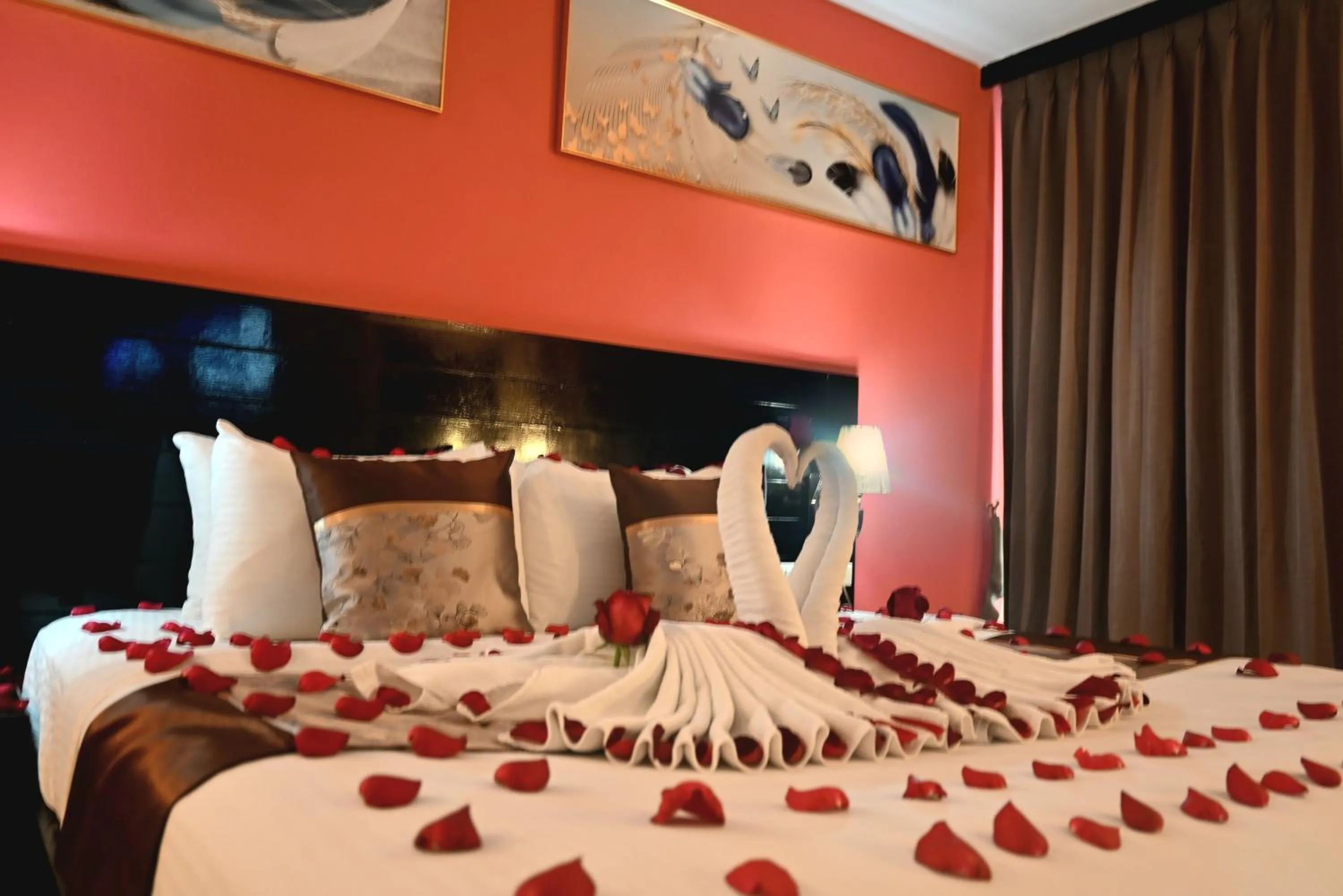 Bed in Boss Suites Nana Hotel