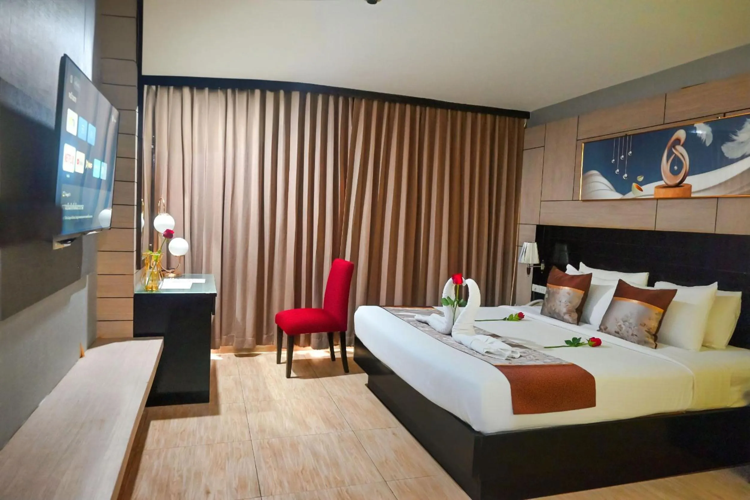 Bed in Boss Suites Nana Hotel