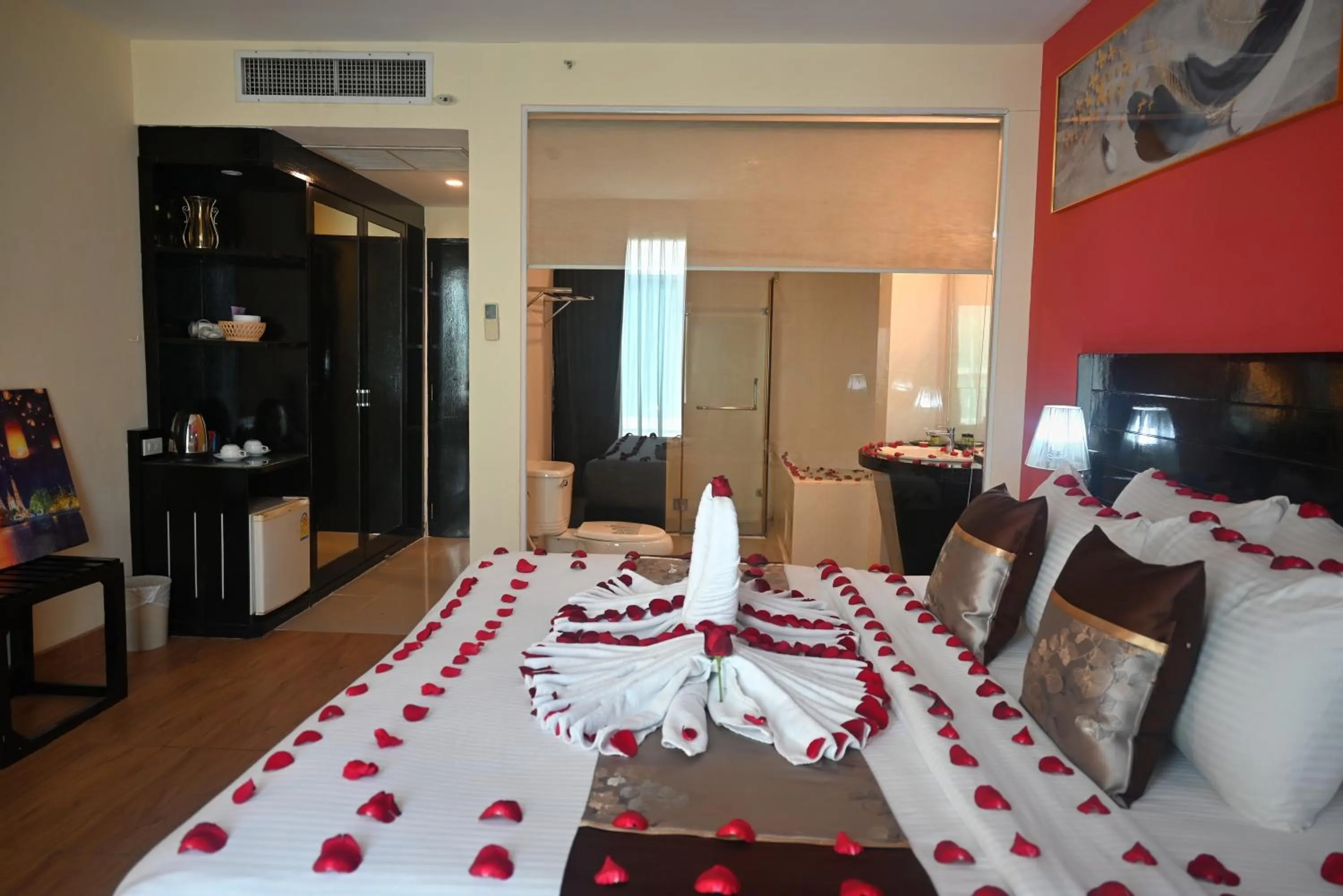 Bed in Boss Suites Nana Hotel