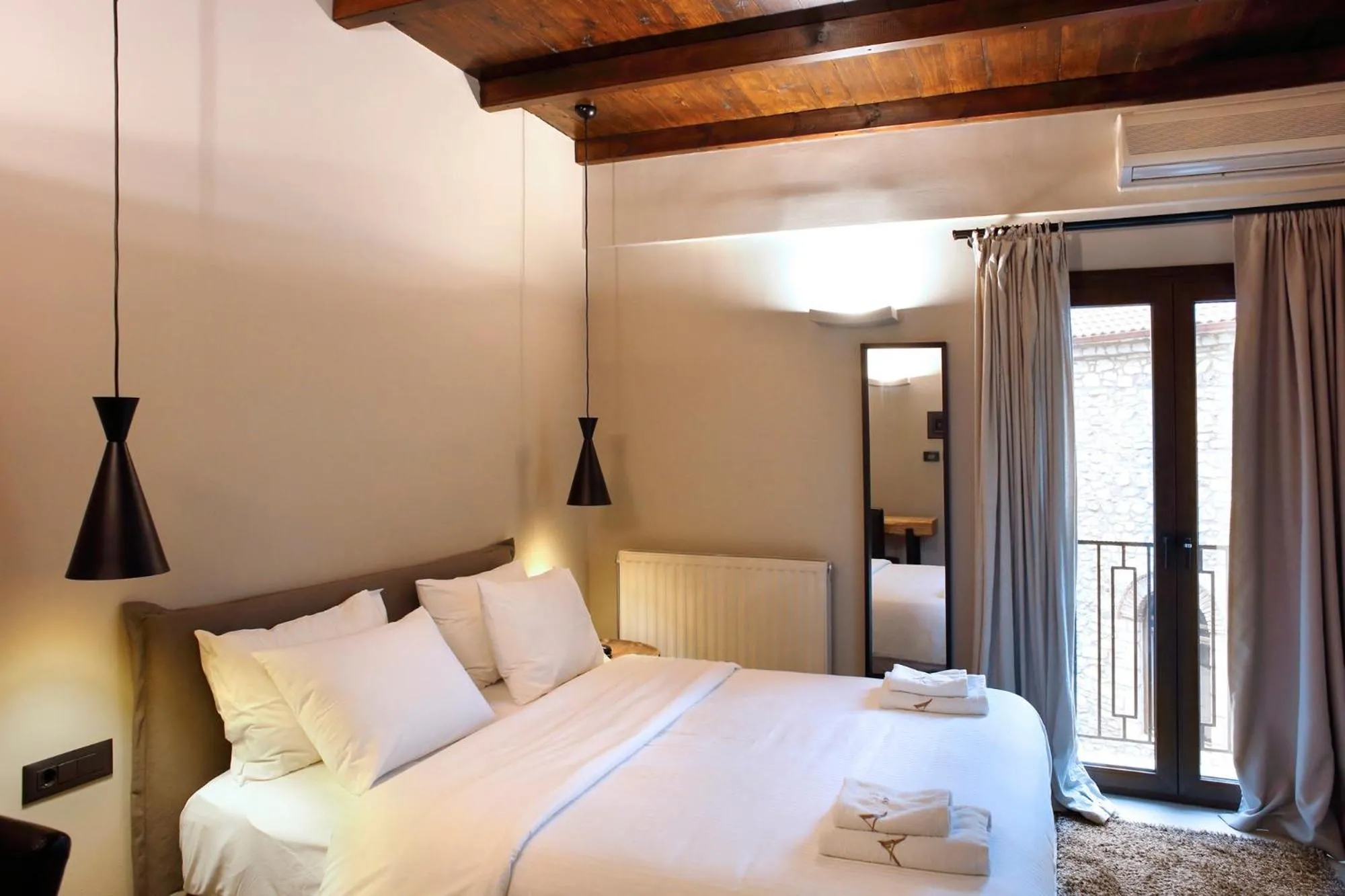 Bed in Anesis Hotel