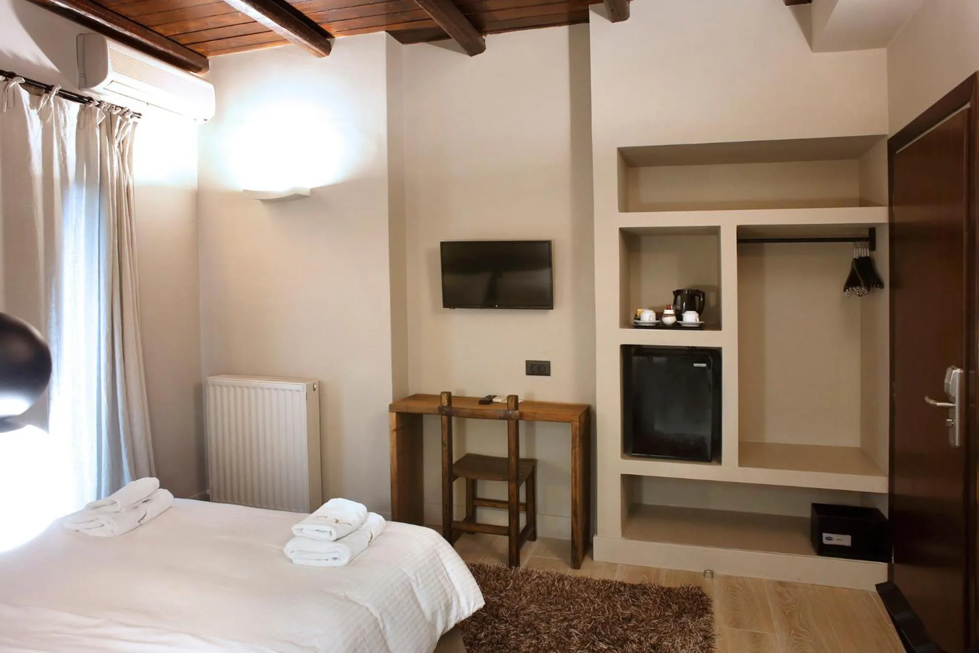 Bed in Anesis Hotel
