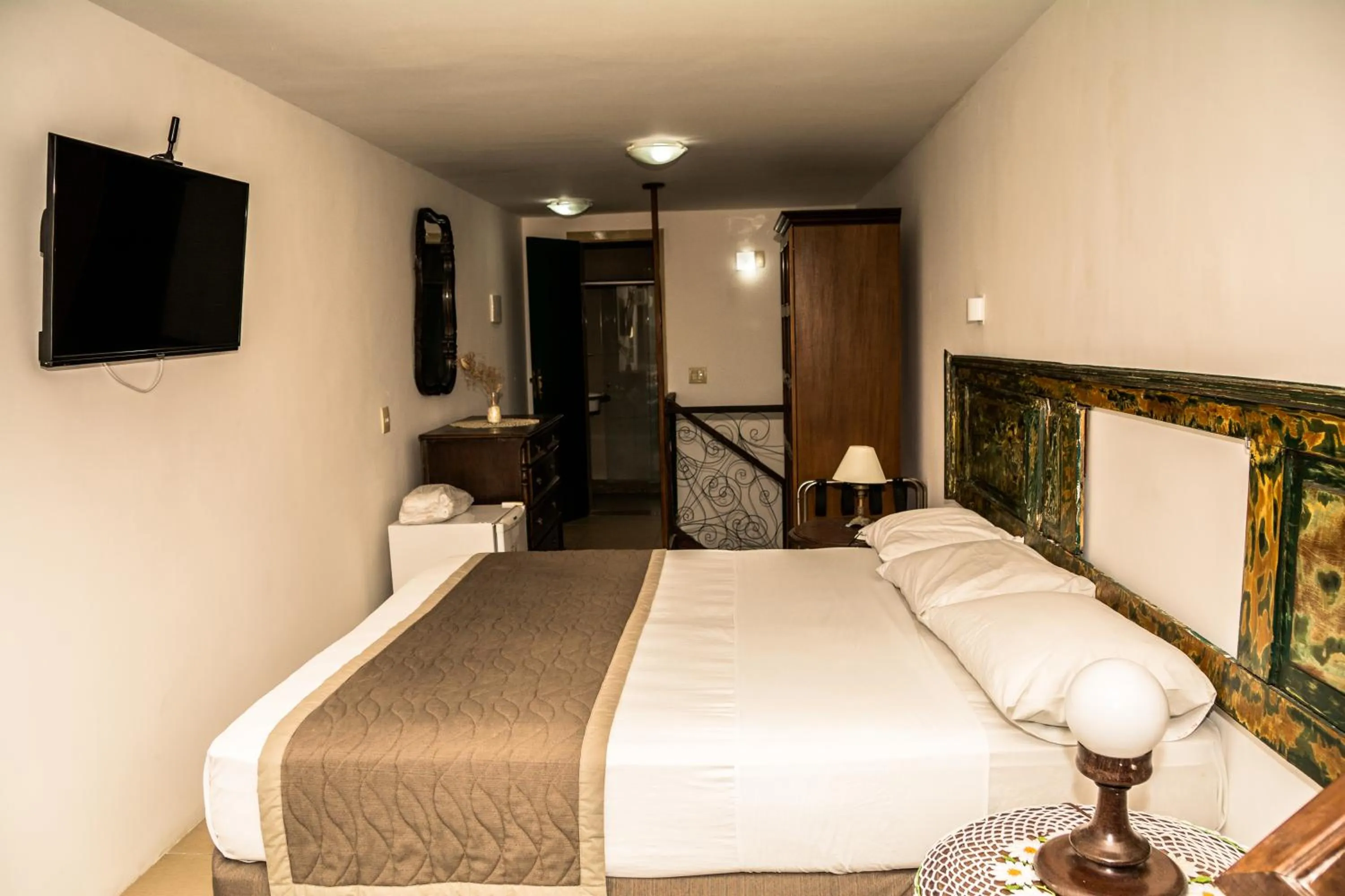 Bed in Pousada dos Quatro Cantos