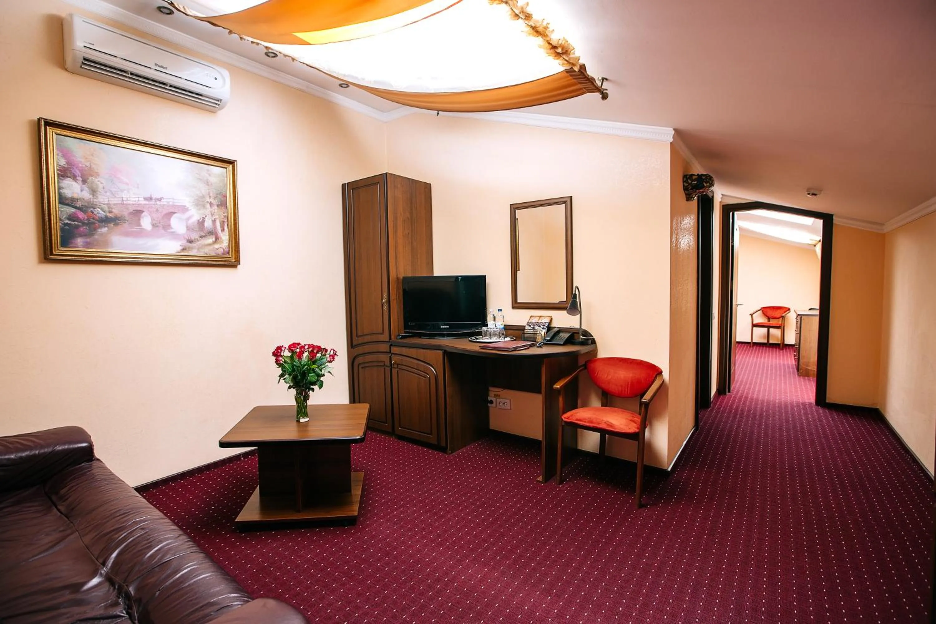 Communal lounge/ TV room in Edem Hotel Lviv