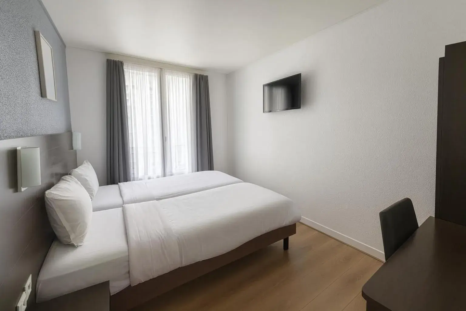 Bed in Hotel Arc Paris Porte d'Orléans Bed in Hotel Arc Paris Porte d'Orléans