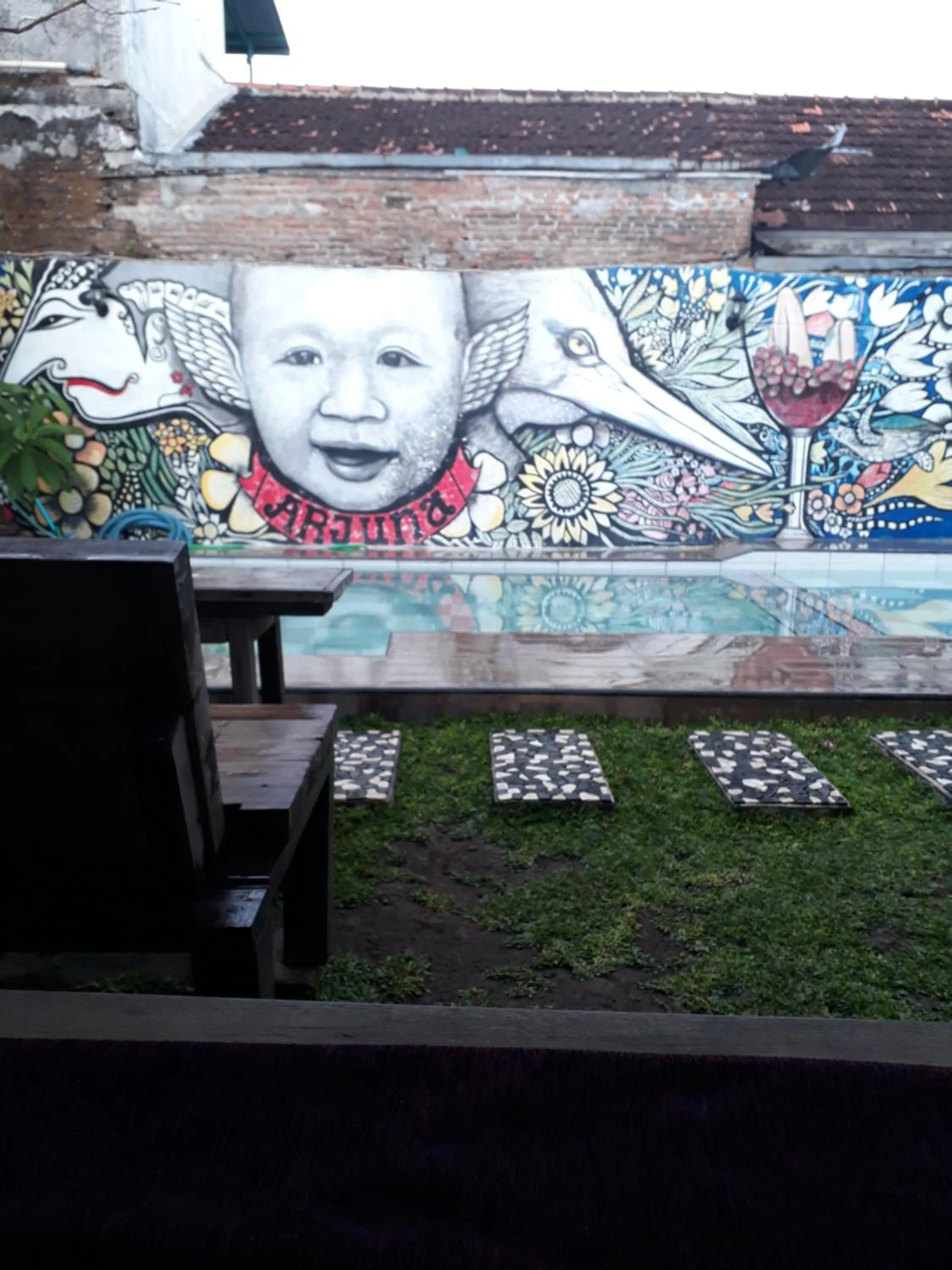 Property logo or sign in Arjuna Garden Homestay