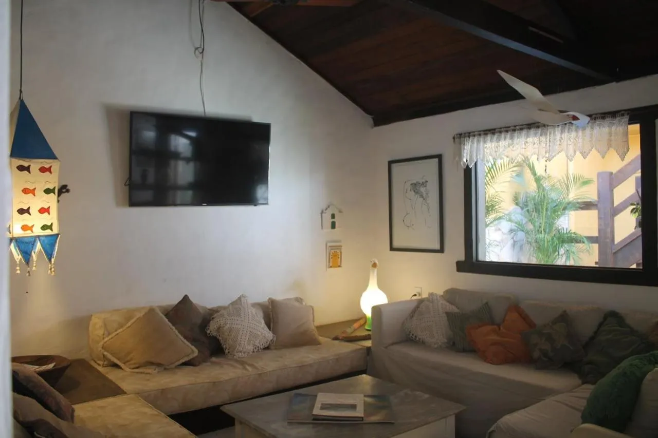 Communal lounge/ TV room in Aquarius Osteria