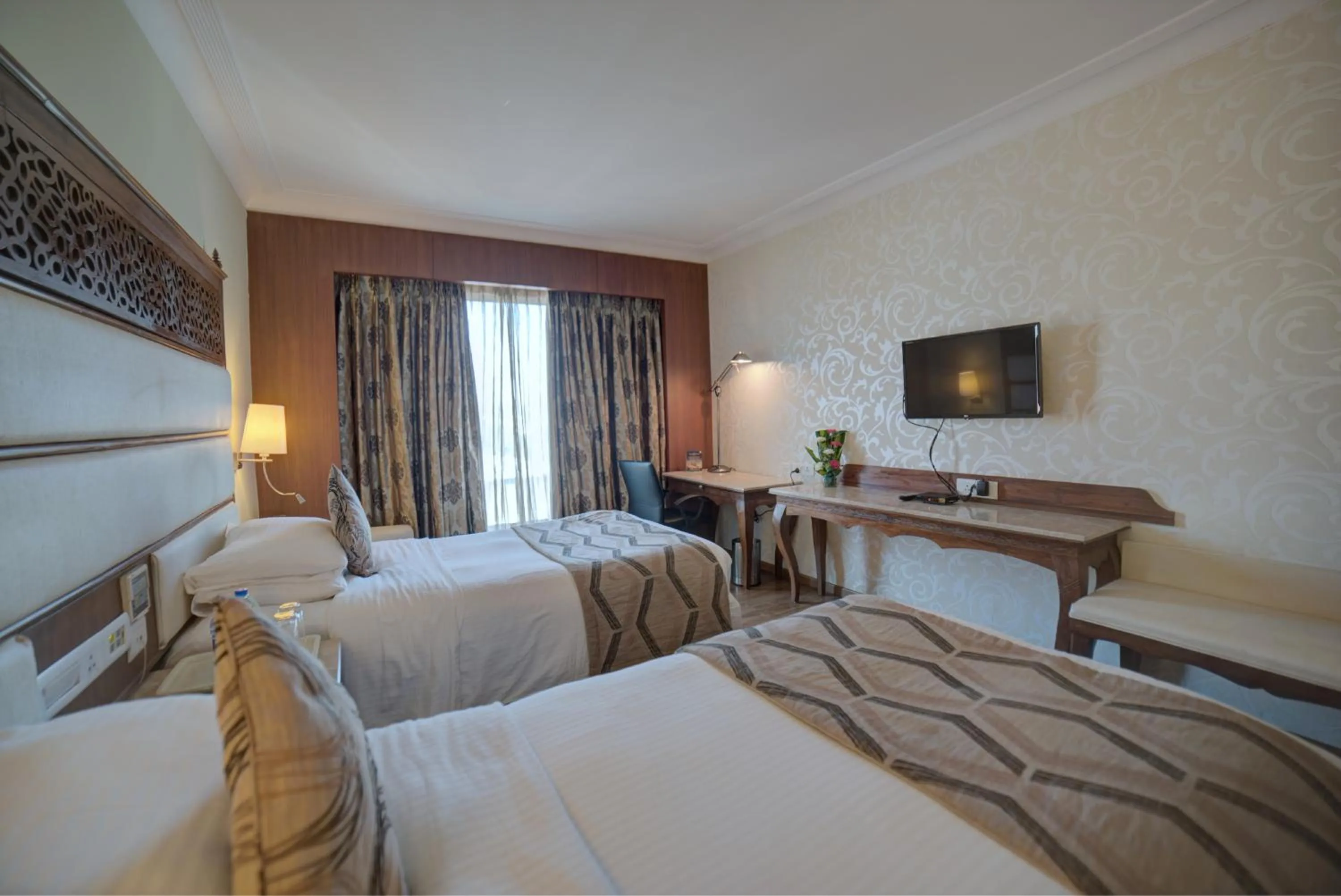 Photo of the whole room, Bed in Goldfinch Hotel Bangalore