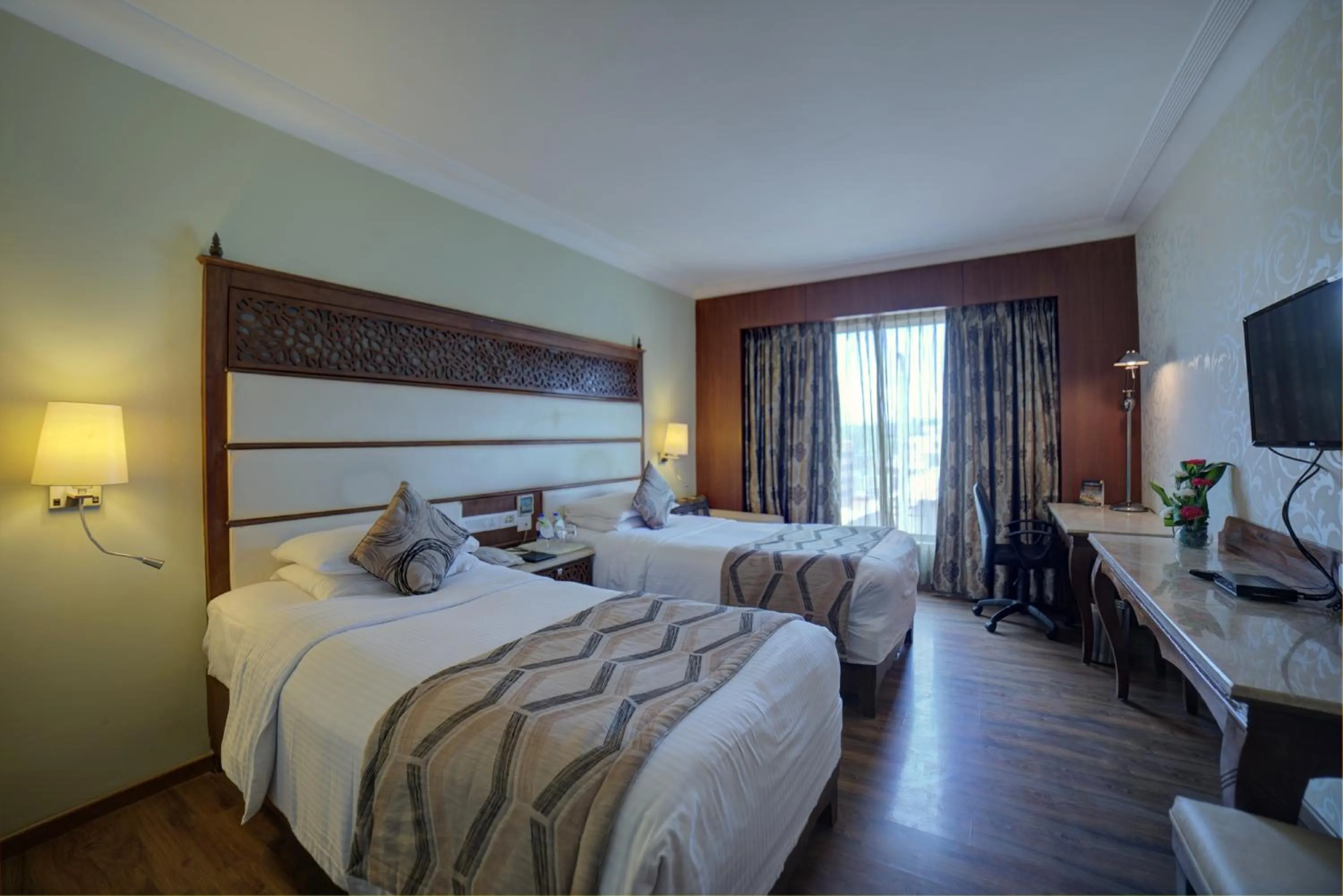 Bed in Goldfinch Hotel Bangalore