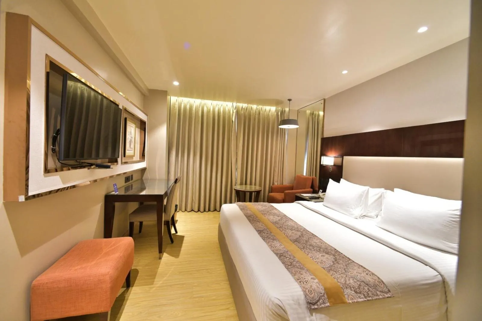 Bedroom, Bed in Citadel Sarovar Portico Bengaluru