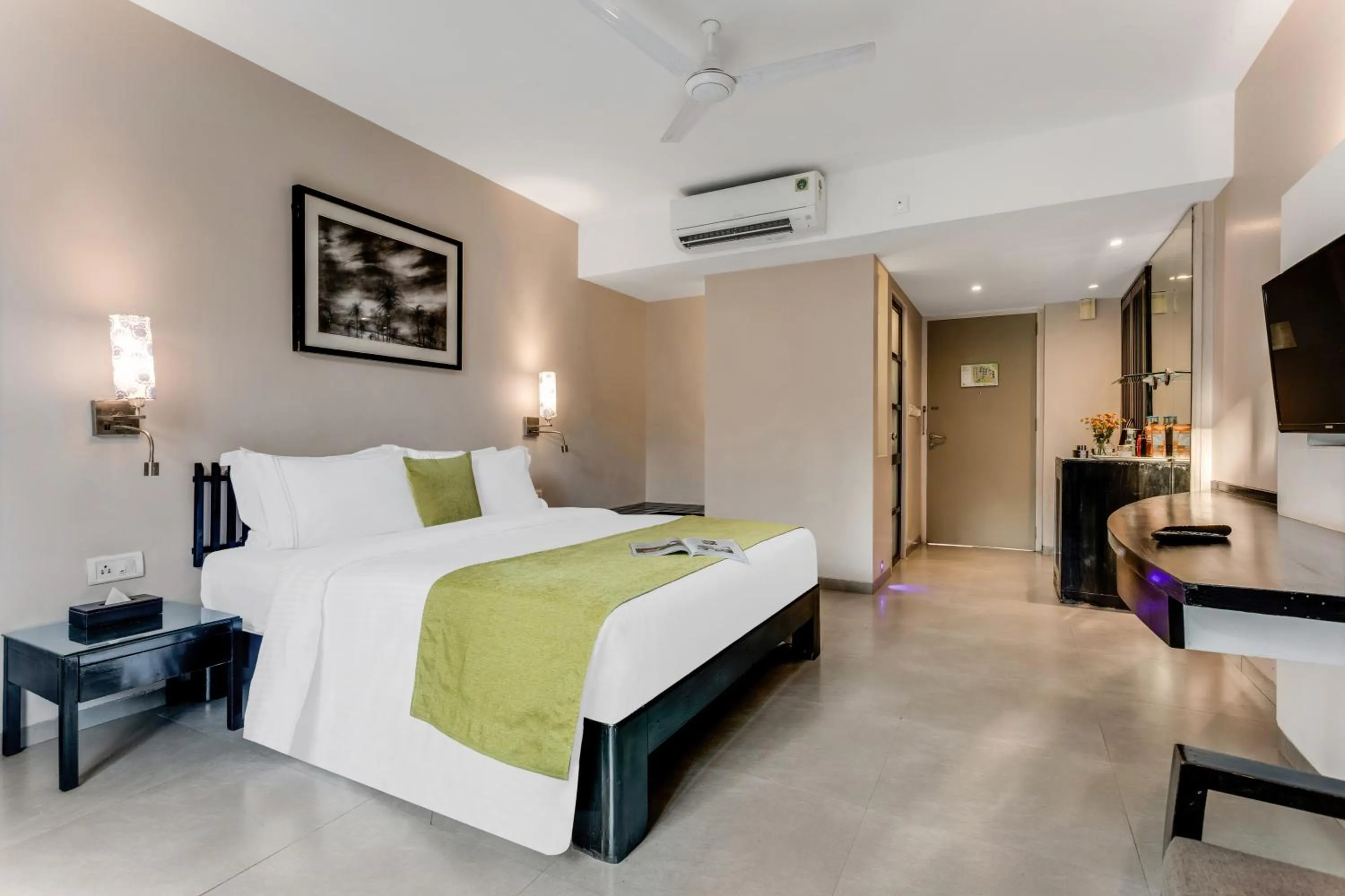 Bed in Whispering Palms Beach Resort