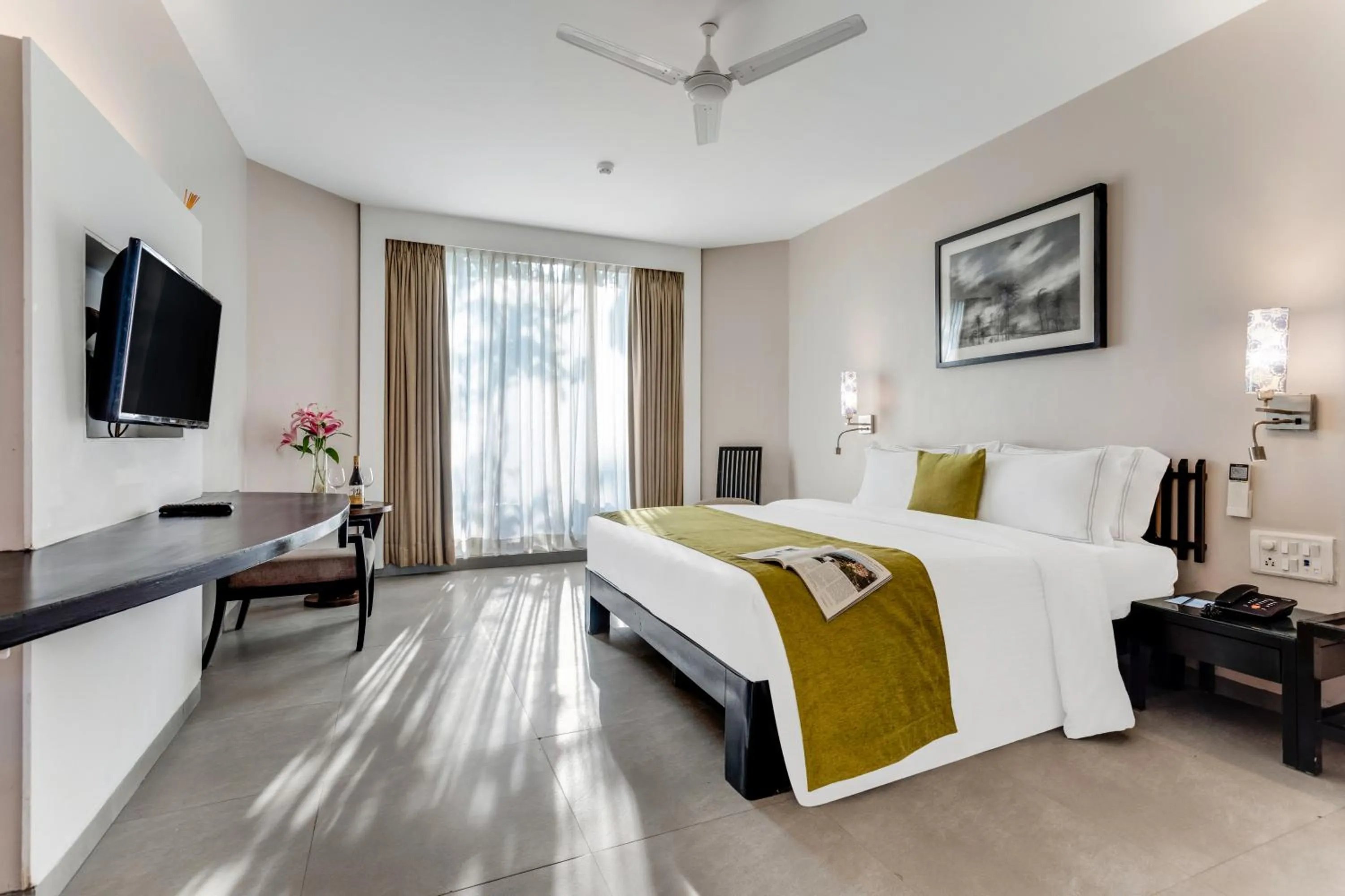 Bed in Whispering Palms Beach Resort