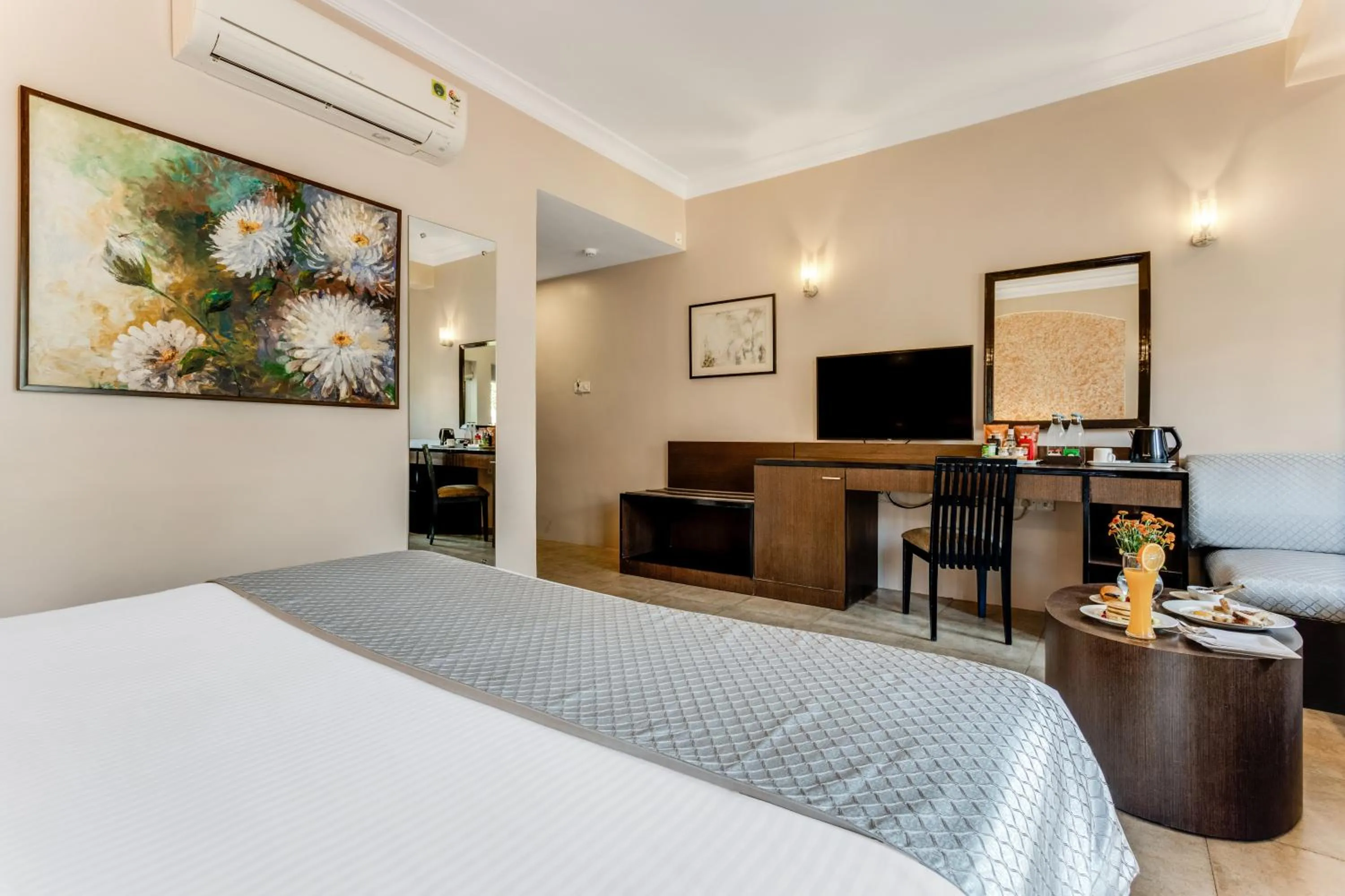 Bed in Whispering Palms Beach Resort