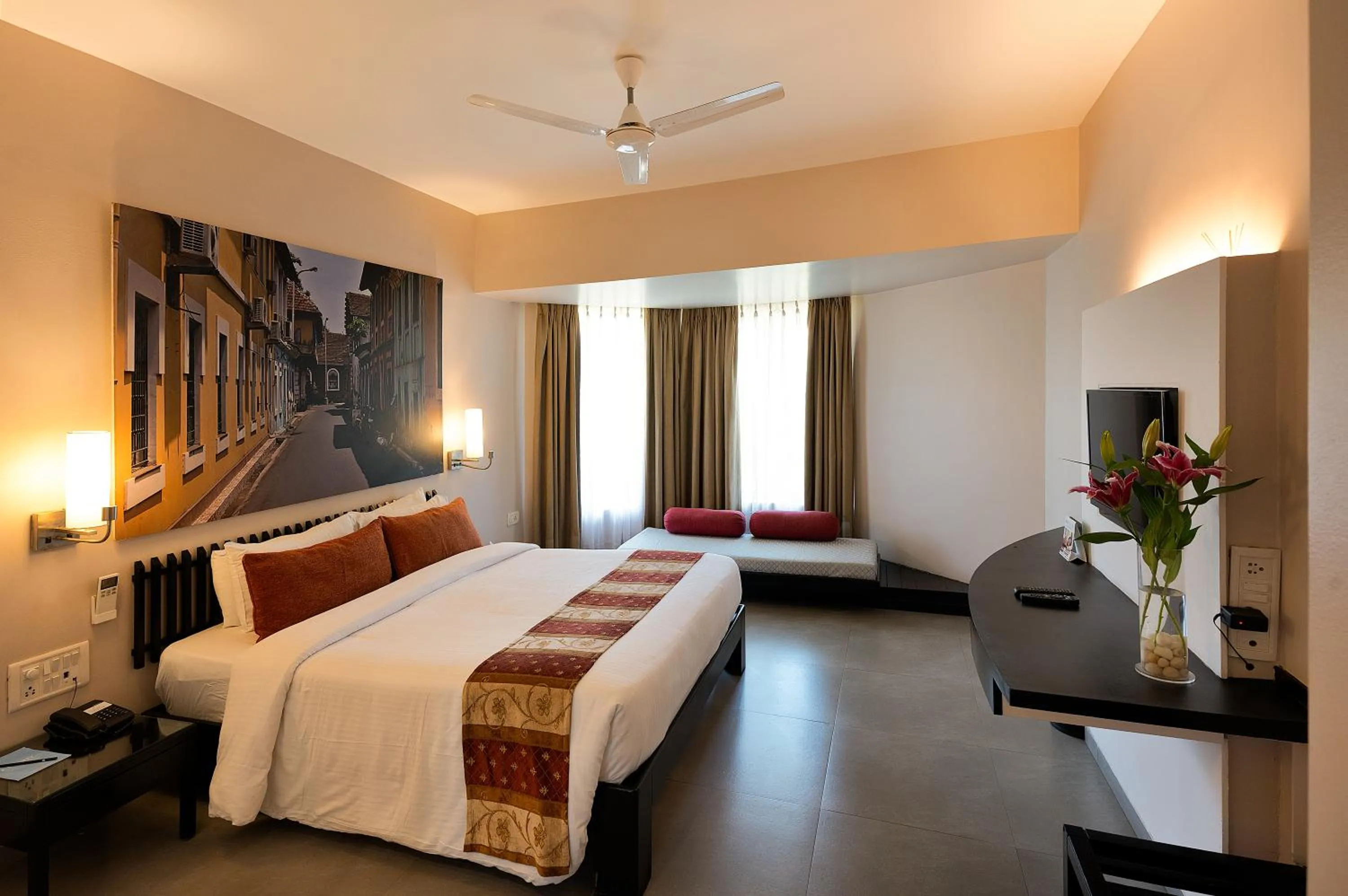 Bed in Whispering Palms Beach Resort