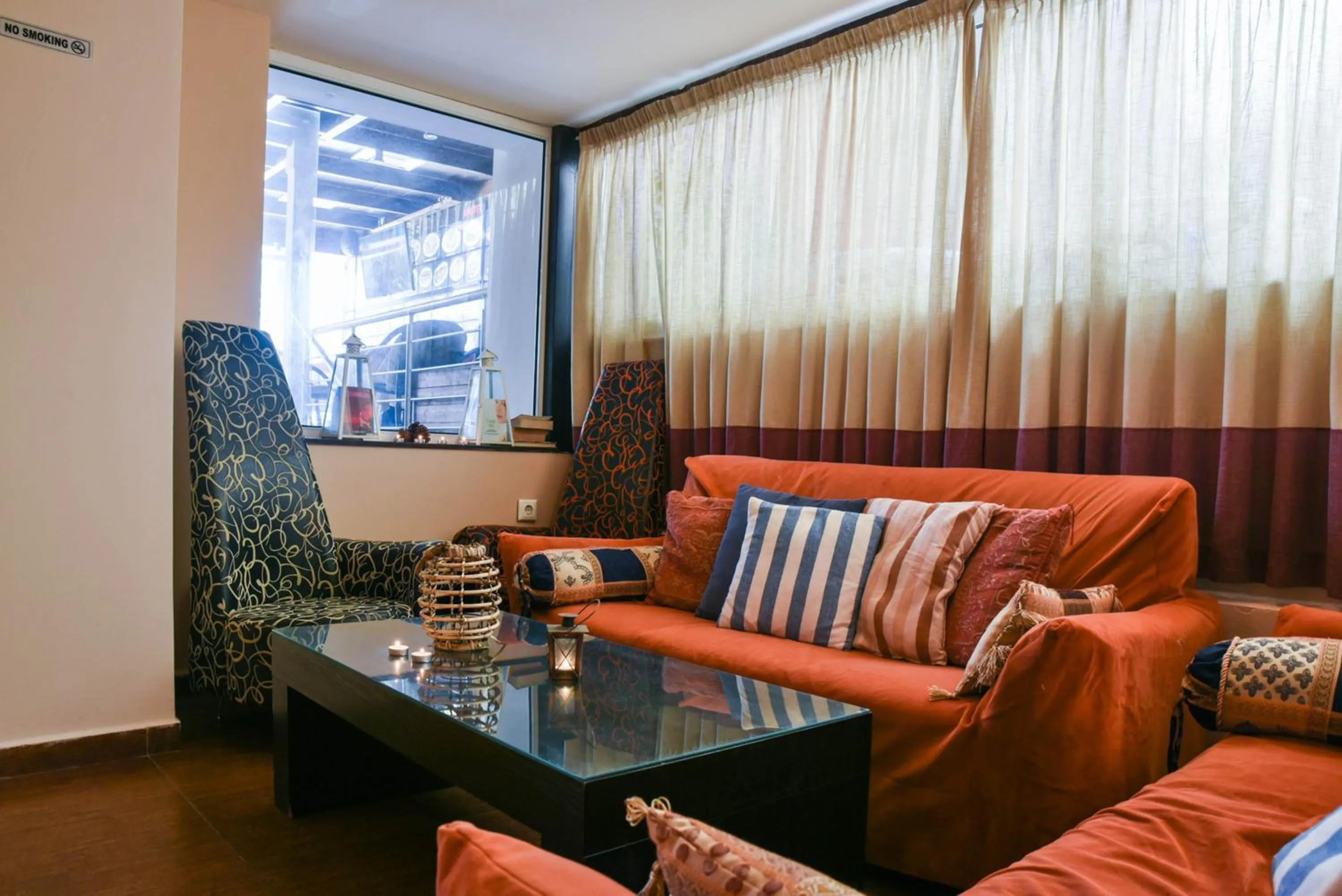 Communal lounge/ TV room, Seating Area in Amaryllis Hotel