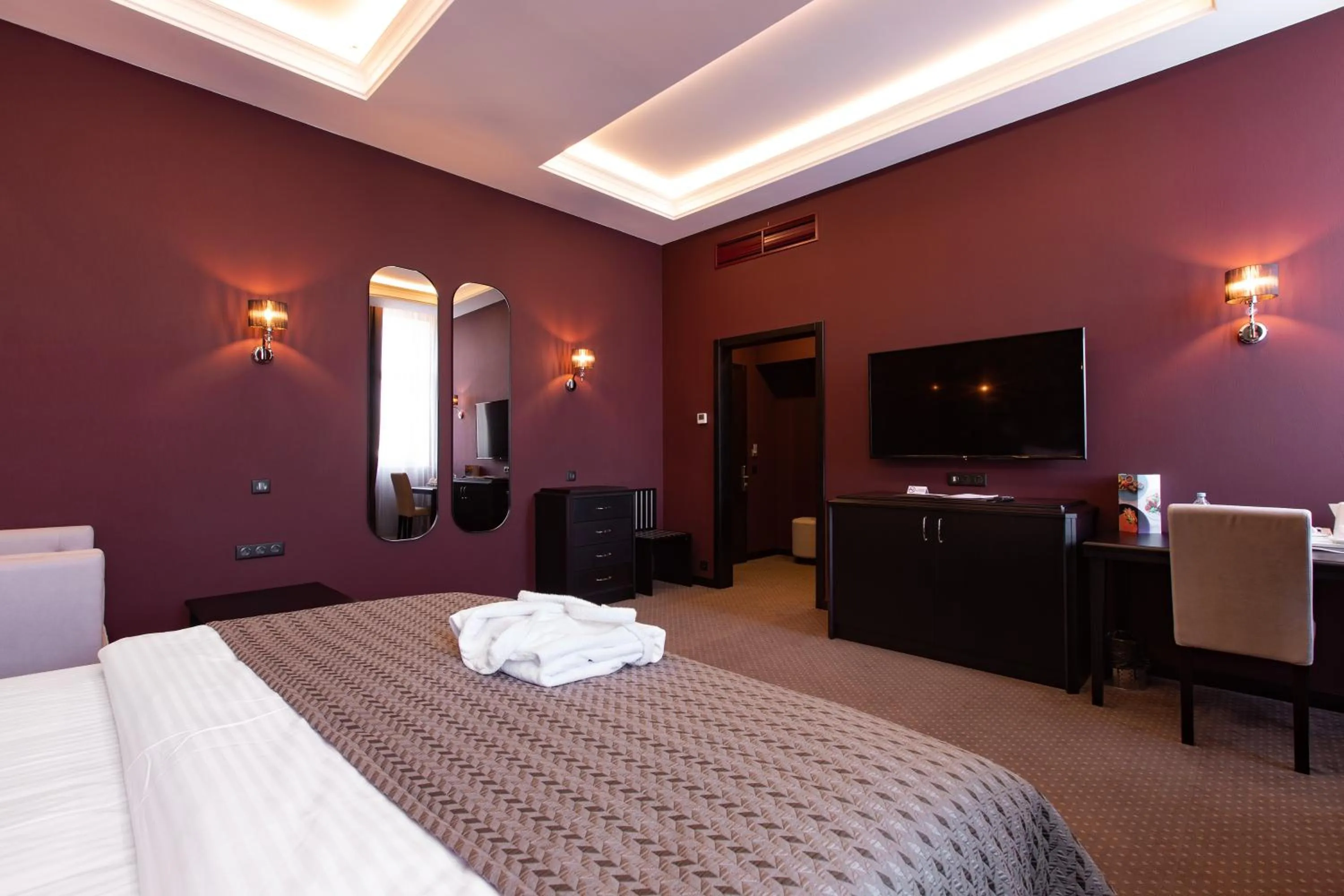 Bed in Tsunami Spa Hotel